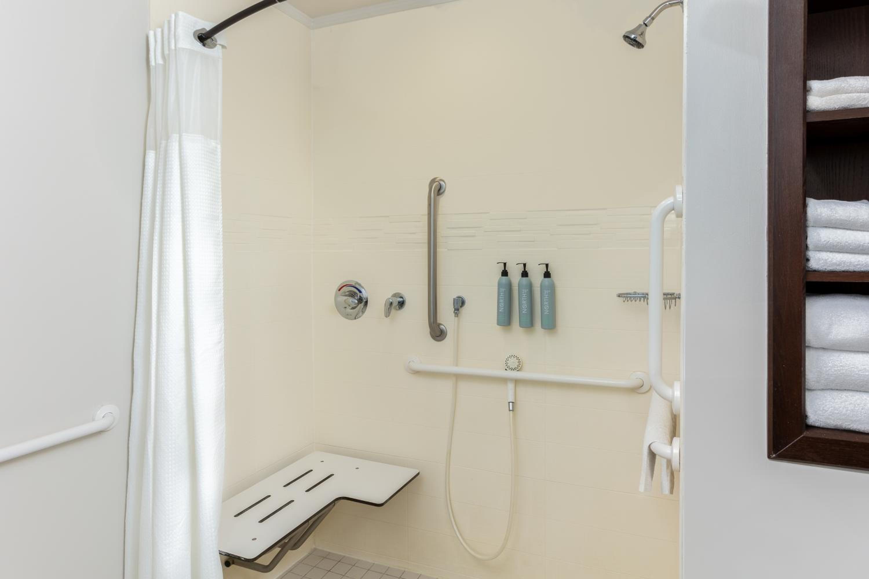 One-Bedroom Corner King Suite with Sofa Bed - Mobility/Hearing Accessible with Roll-In Shower