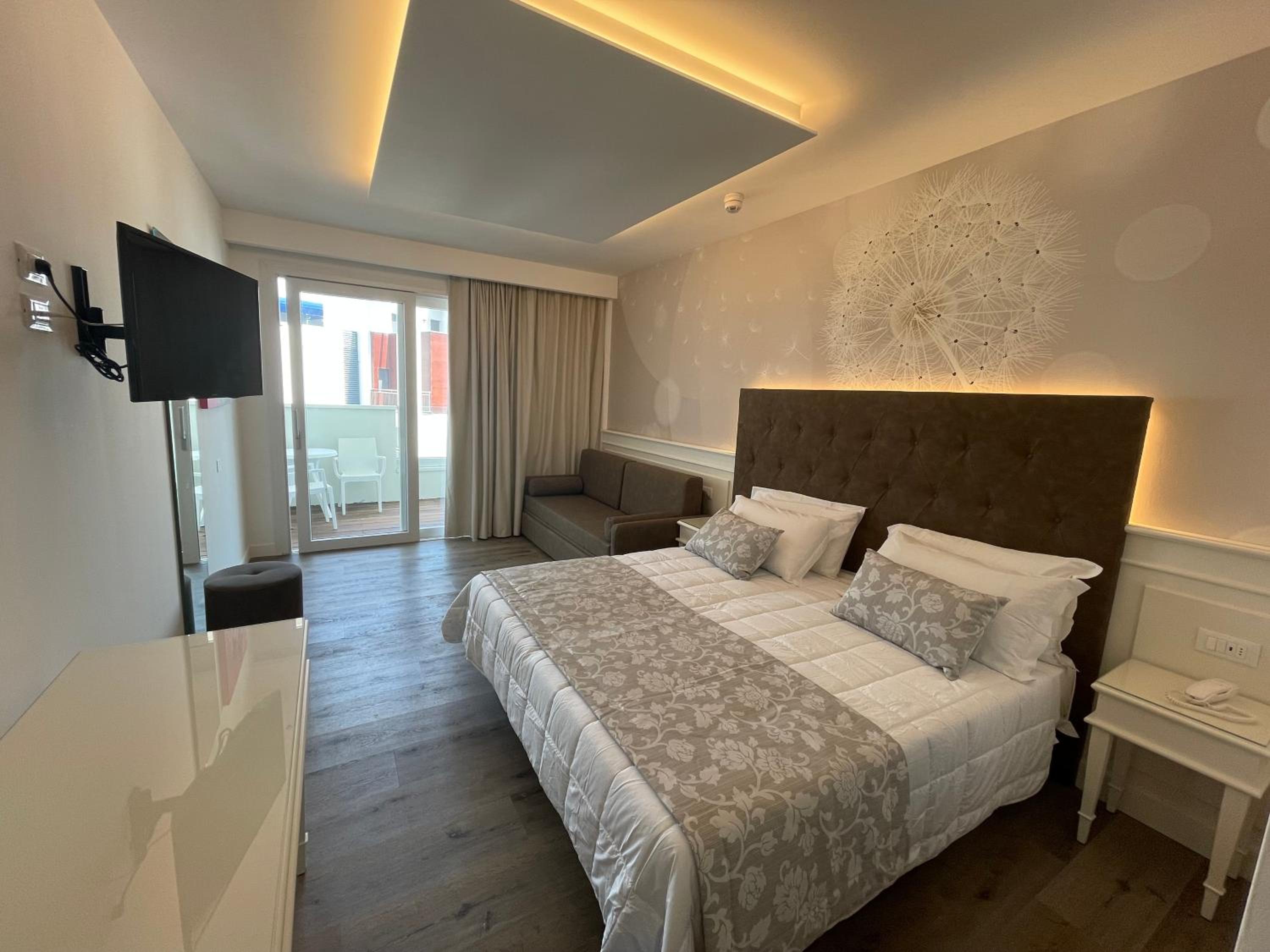 Deluxe Junior Suite with Balcony and Side Sea View