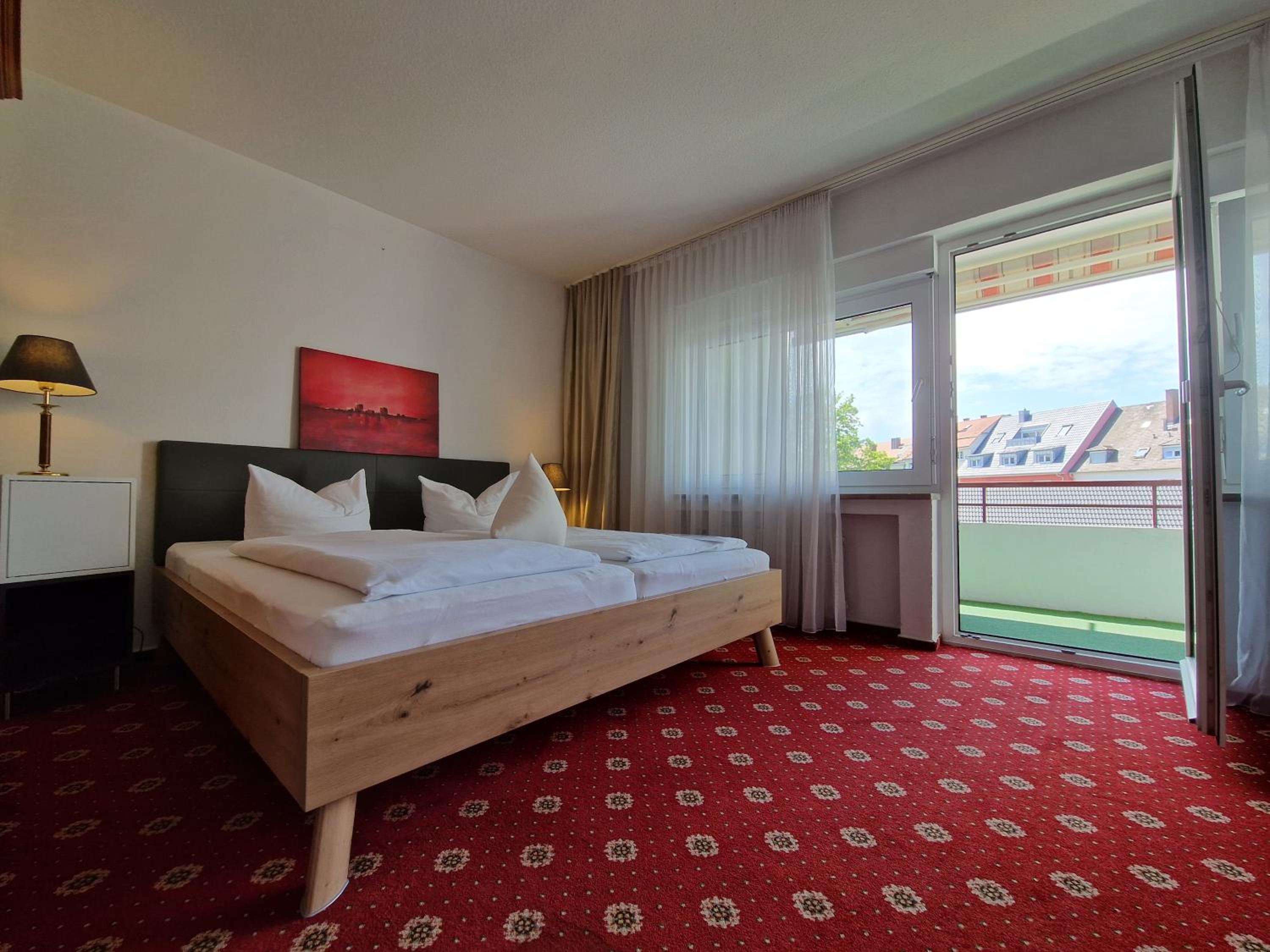 Double Room with Extra Bed and Balcony - Photo 1