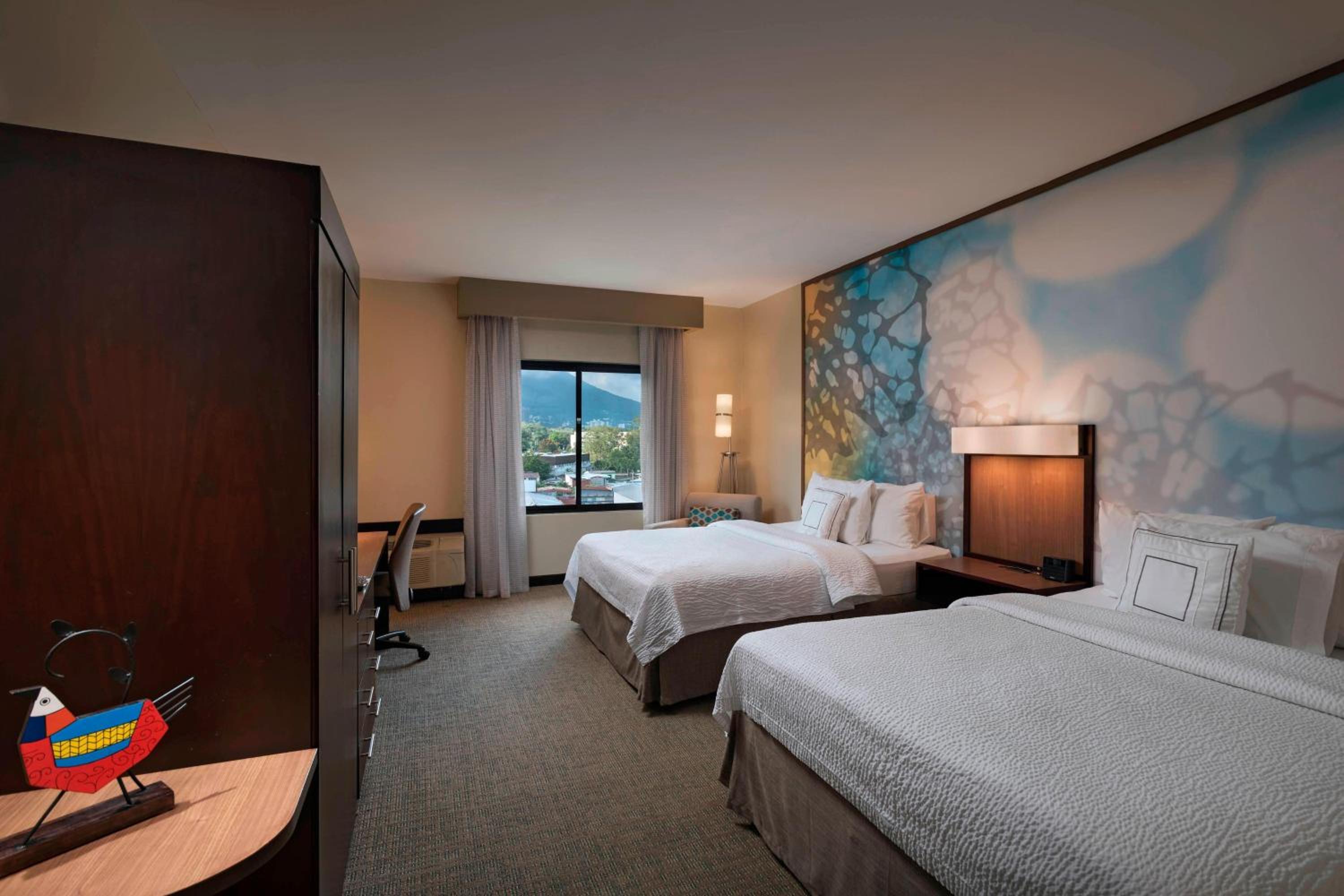 Queen Room with Two Queen Beds - Photo 1