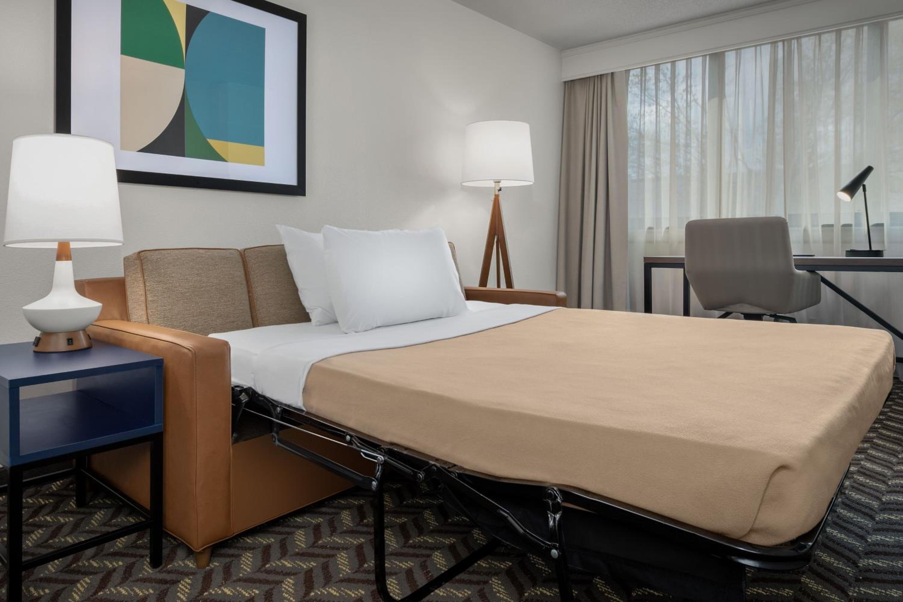 Queen Suite with Two Queen Beds and Sofa Bed - Photo 3