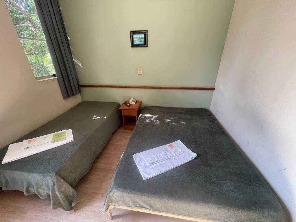 Hara Palace Hotel — Triple Room with 1 Single Bed and 1 Double Bed