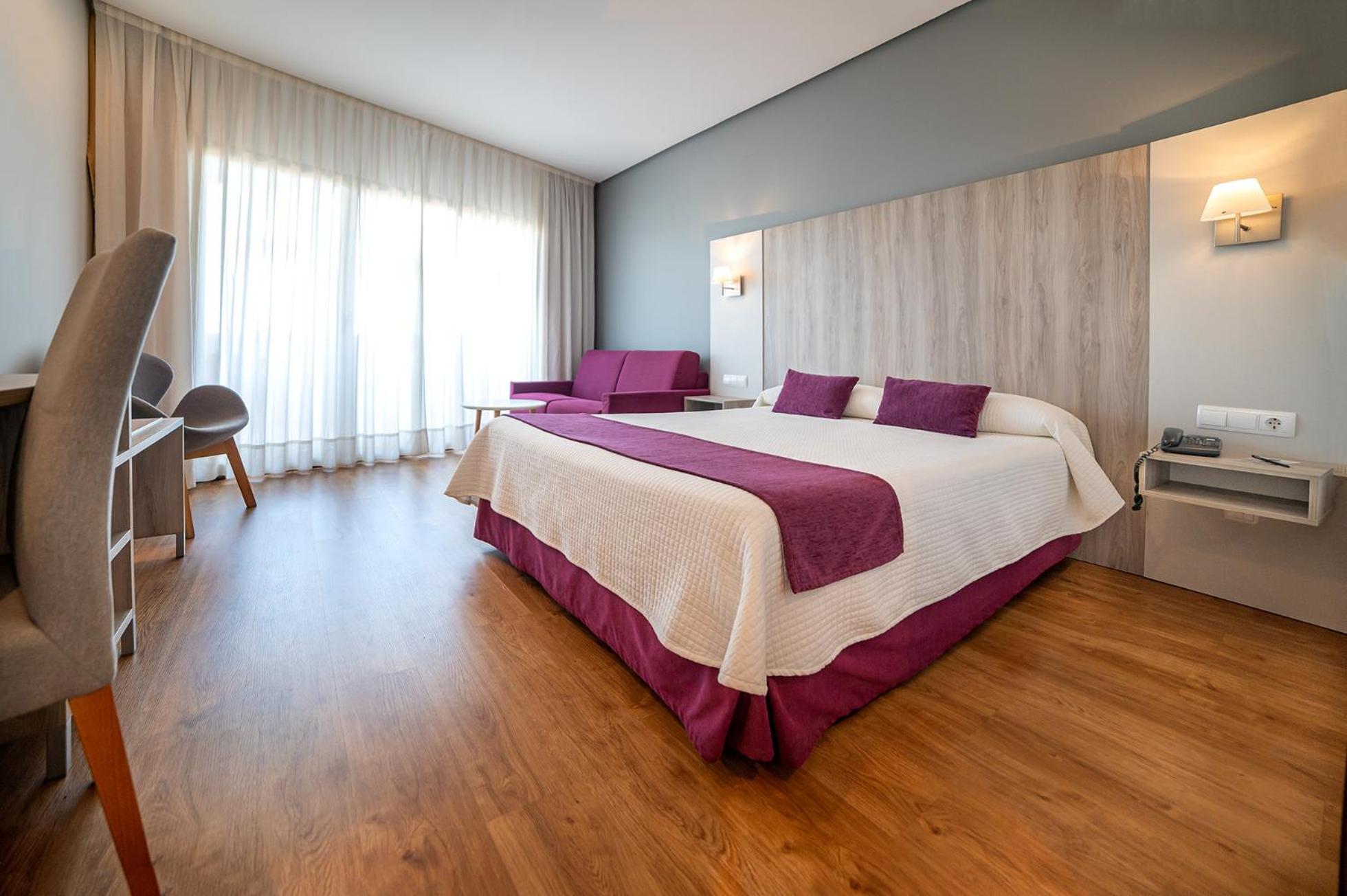 Habitación Doble Deluxe (2 Adultos + 1 Niño)