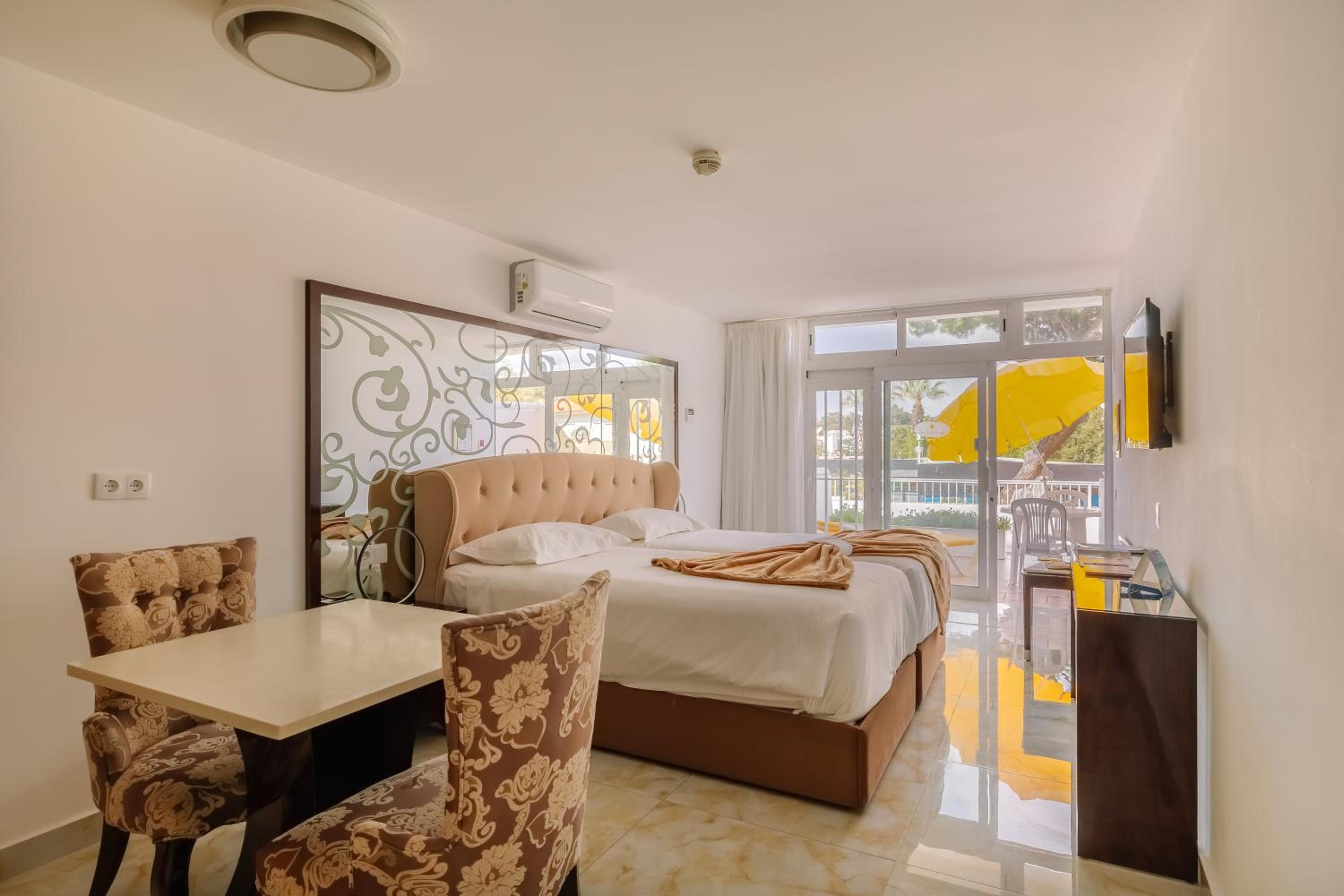 Relax in this cozy and bright hotel room.