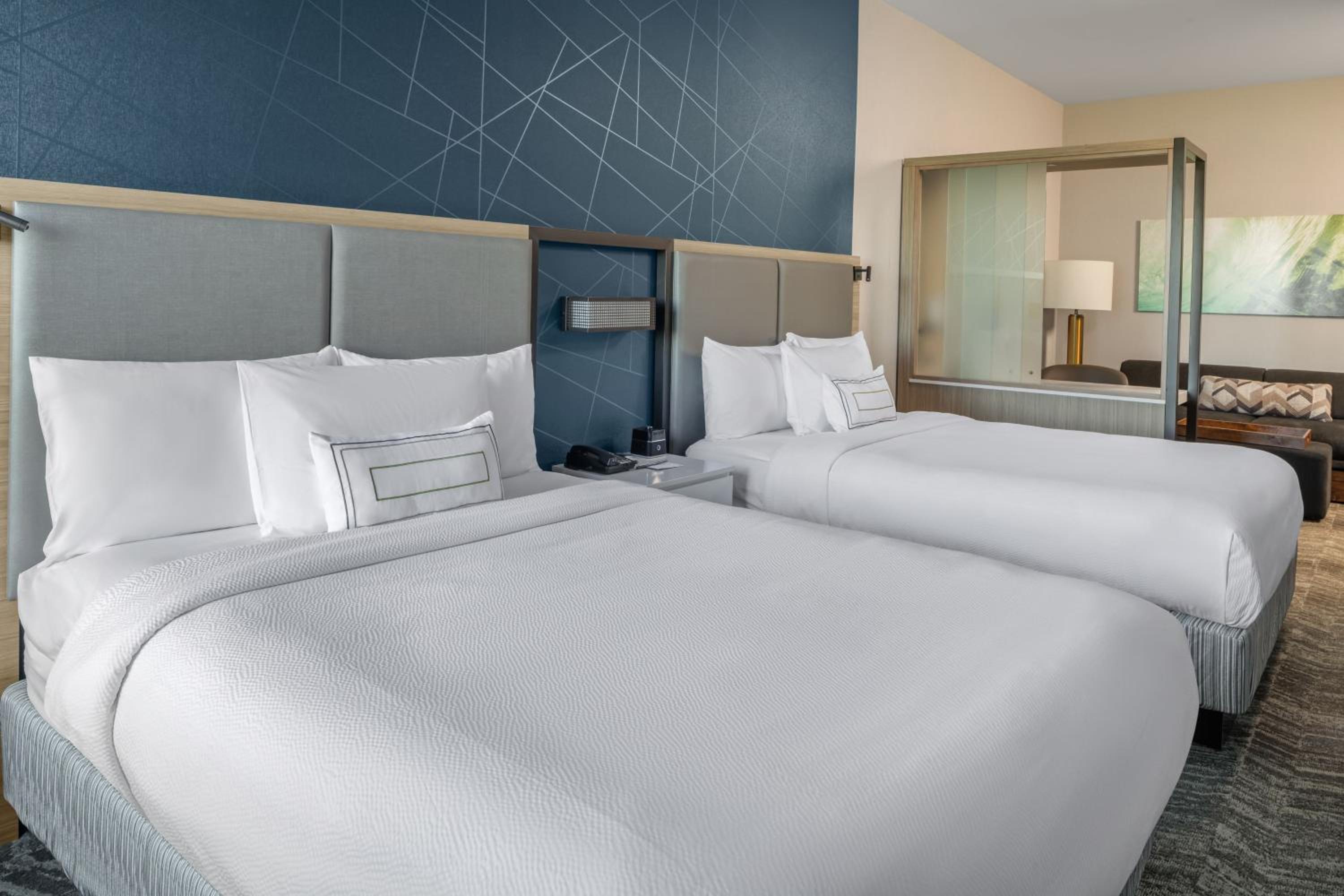 Queen Suite with Two Queen Beds and Sofa Bed - Photo 6