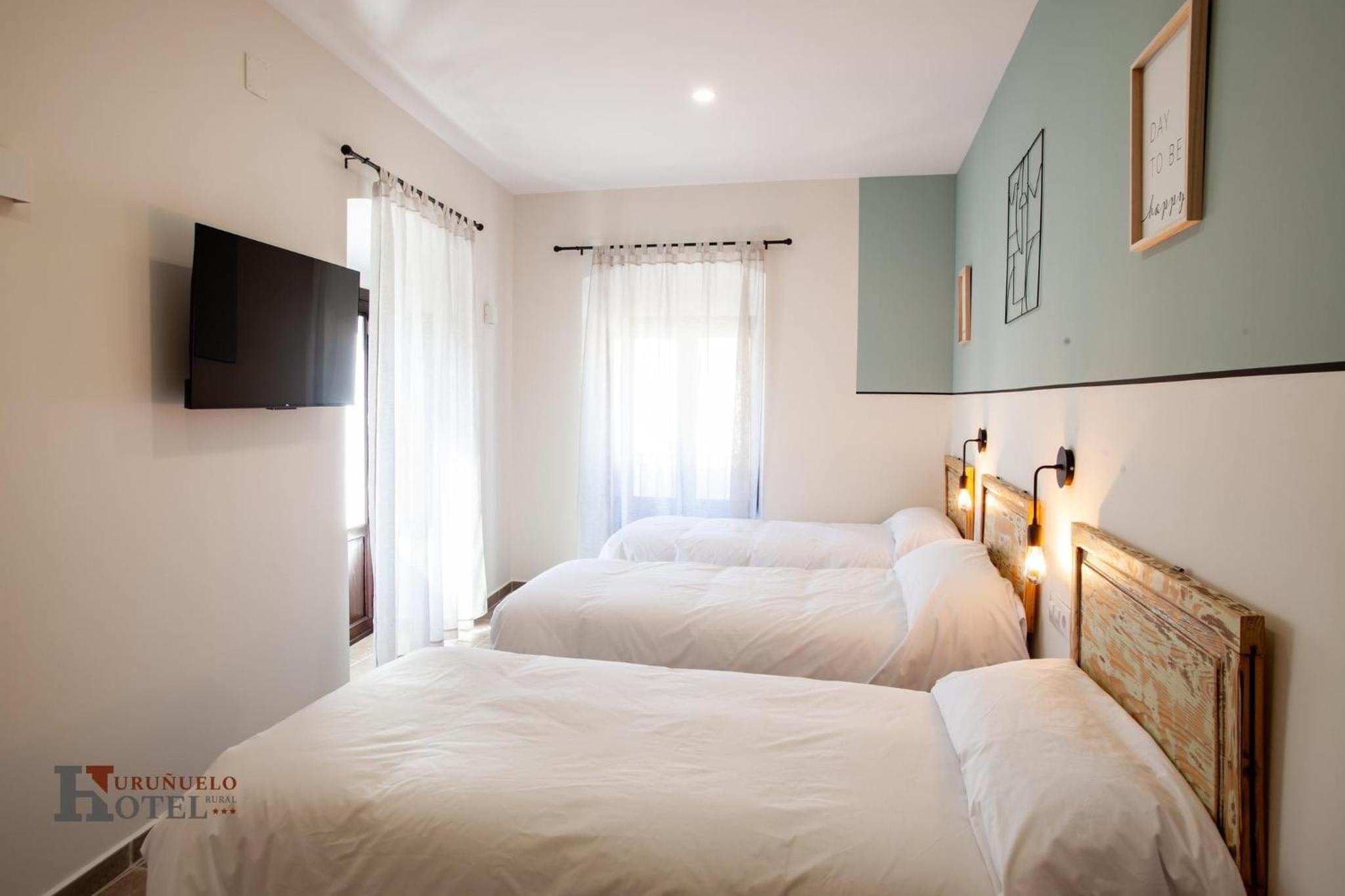 Habitación Triple con Vista a la Ciudad