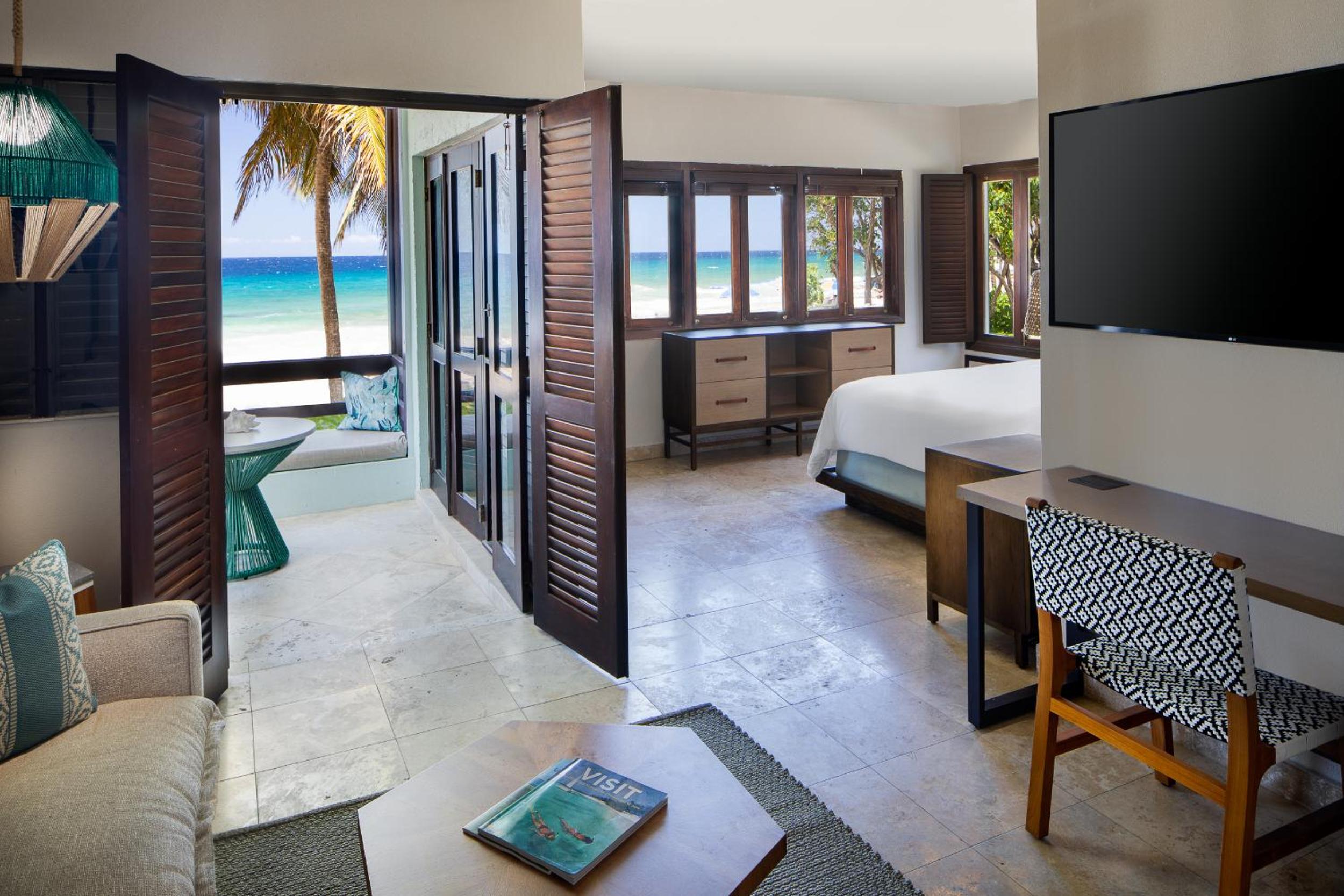 Junior King Suite with Sofa Bed, Patio and Garden View