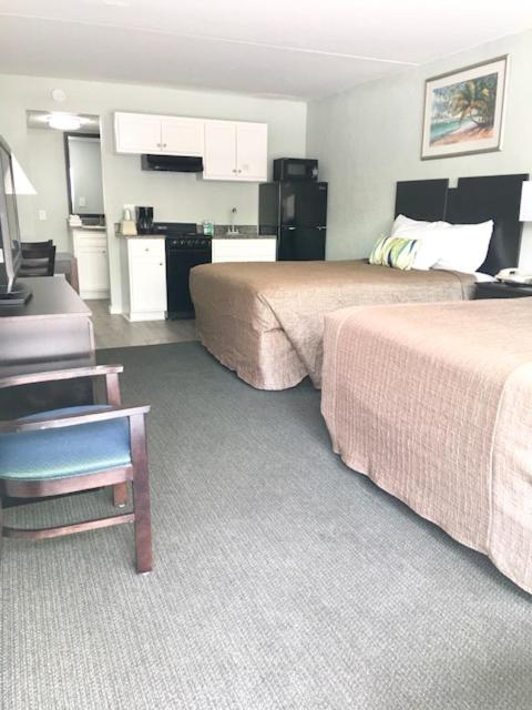 Queen Room with Two Queen Beds and Kitchenette - Photo 1