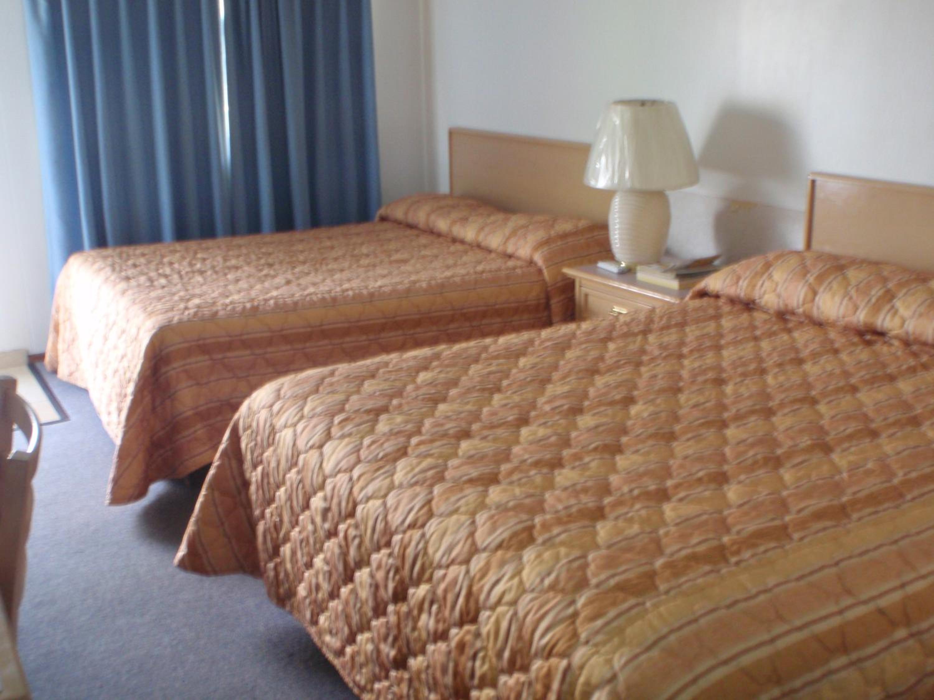 Queen Room with Two Queen Beds - Photo 9