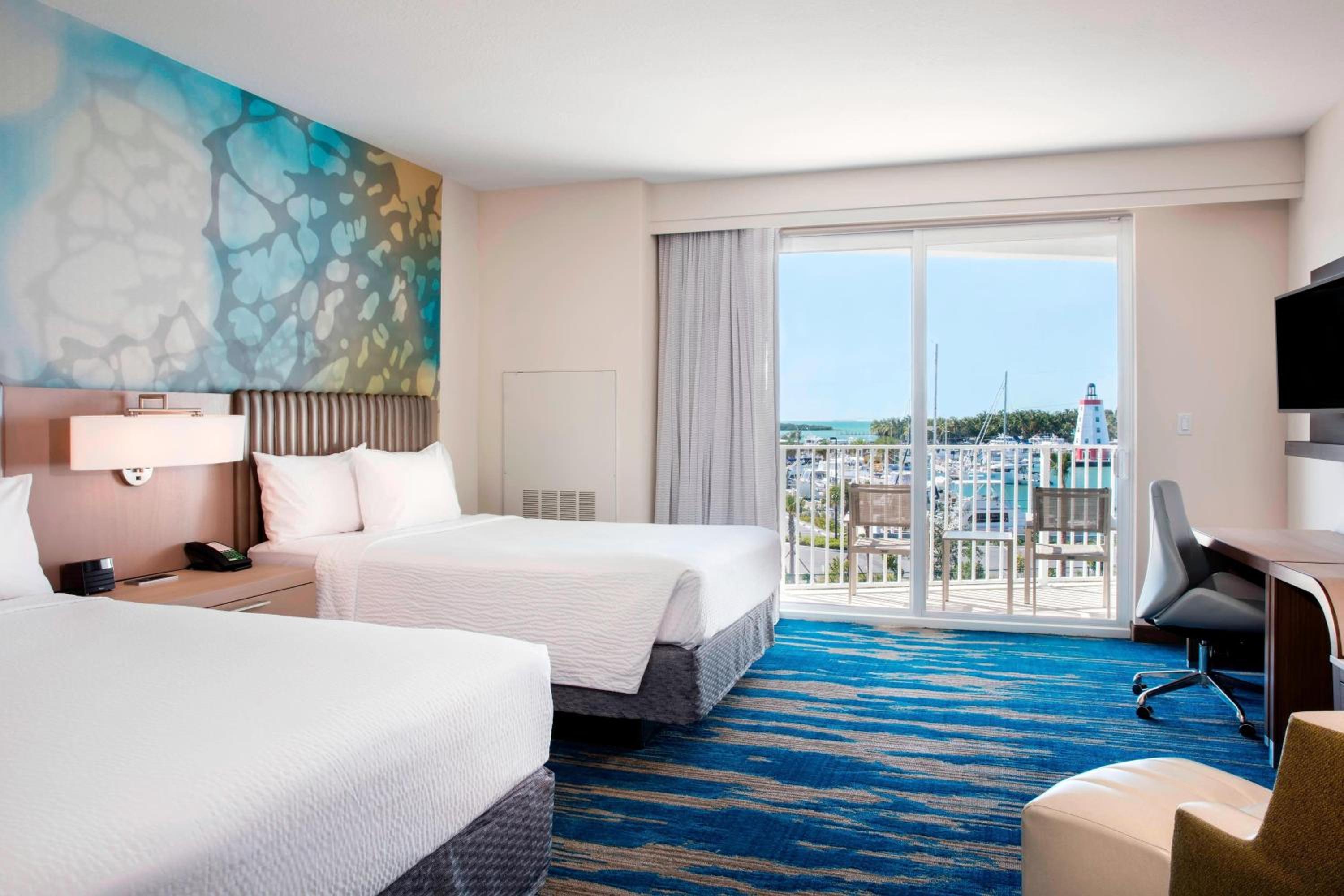 Queen Room with Two Queen Beds with Patio/Balcony and Partial Ocean View photo 1