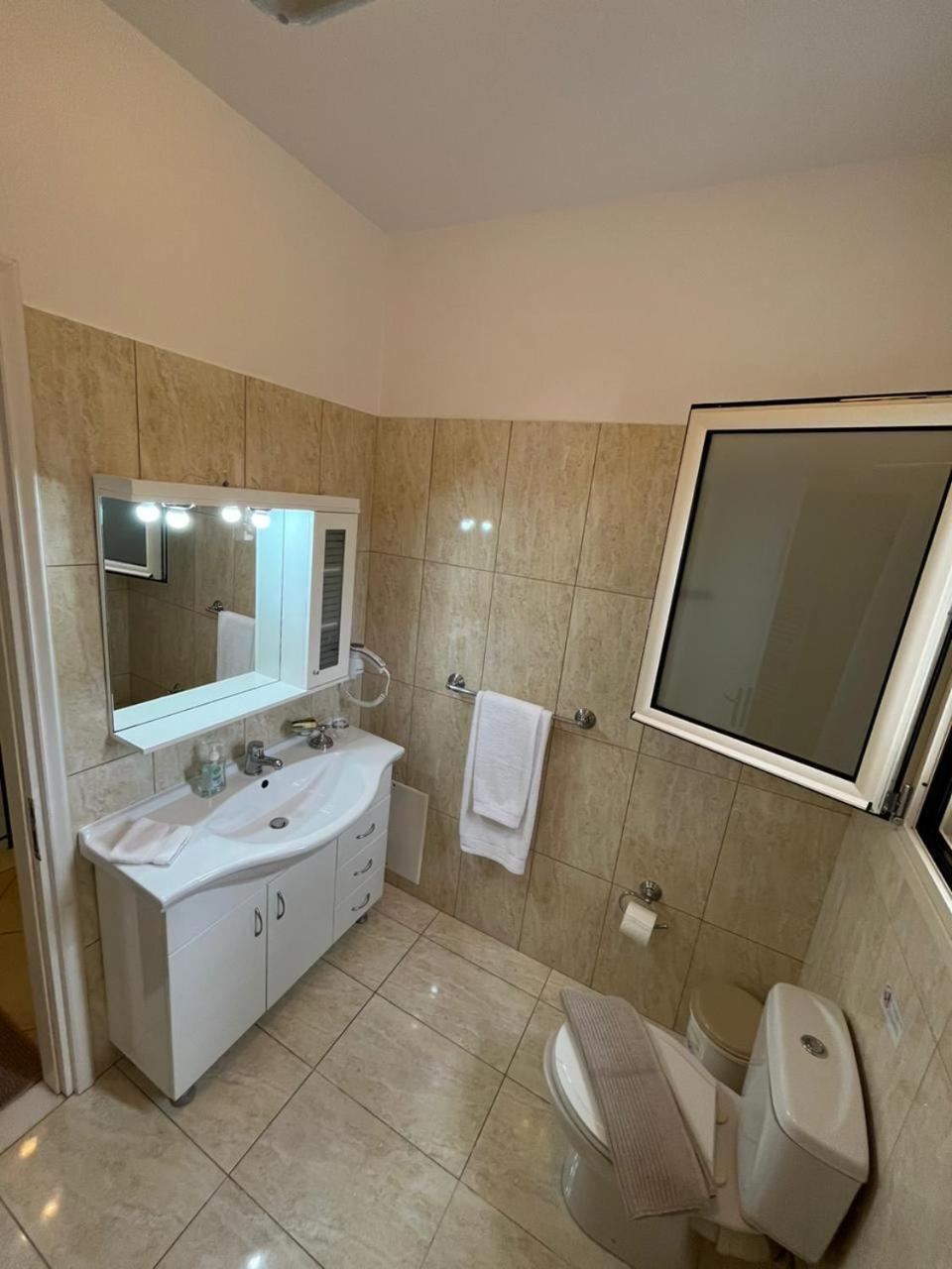 Three-Bedroom House - Photo 25
