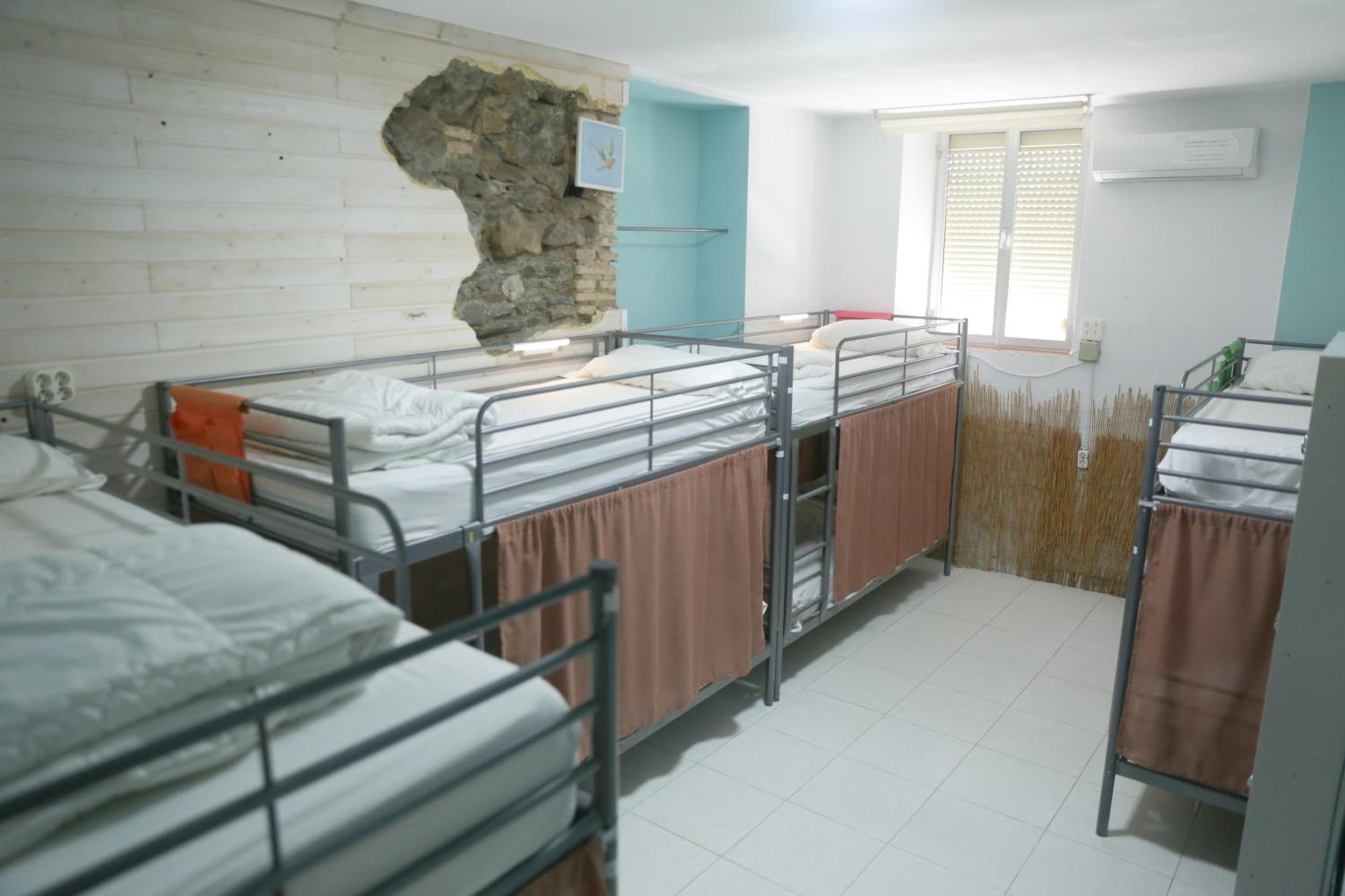 Cama en habitación compartida para 8 personas
