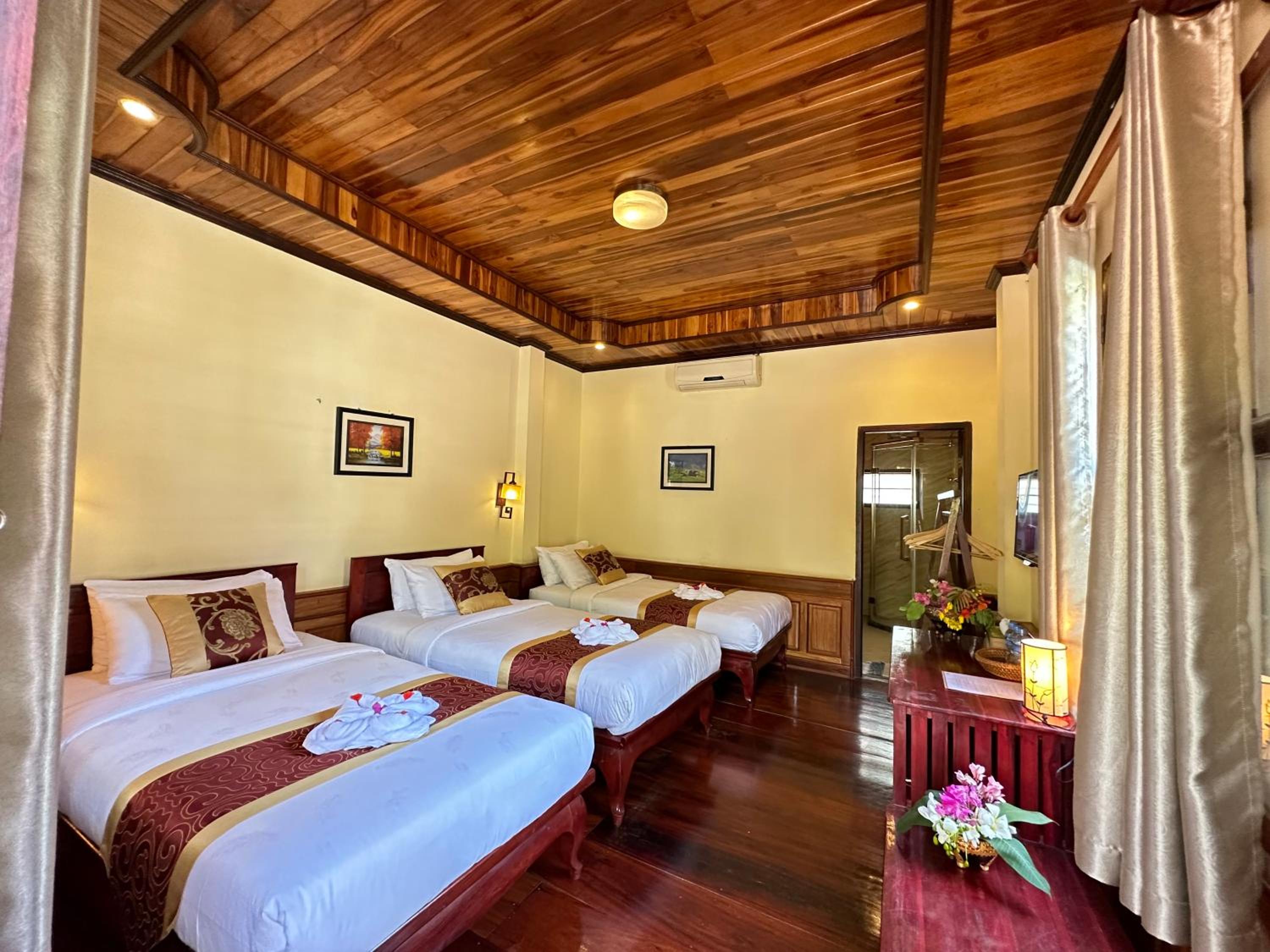 Deluxe Triple Room - Photo 21