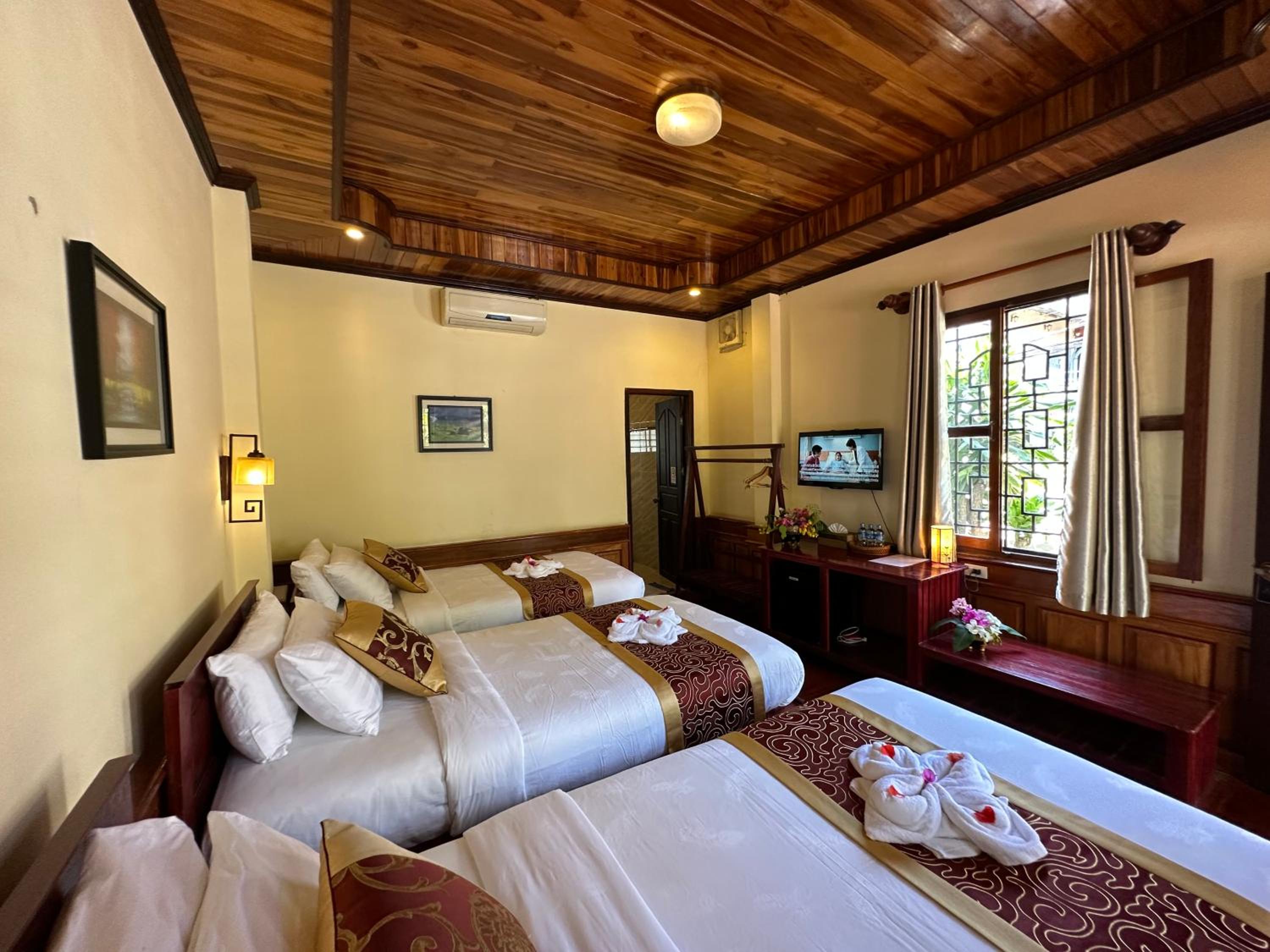 Deluxe Triple Room - Photo 19