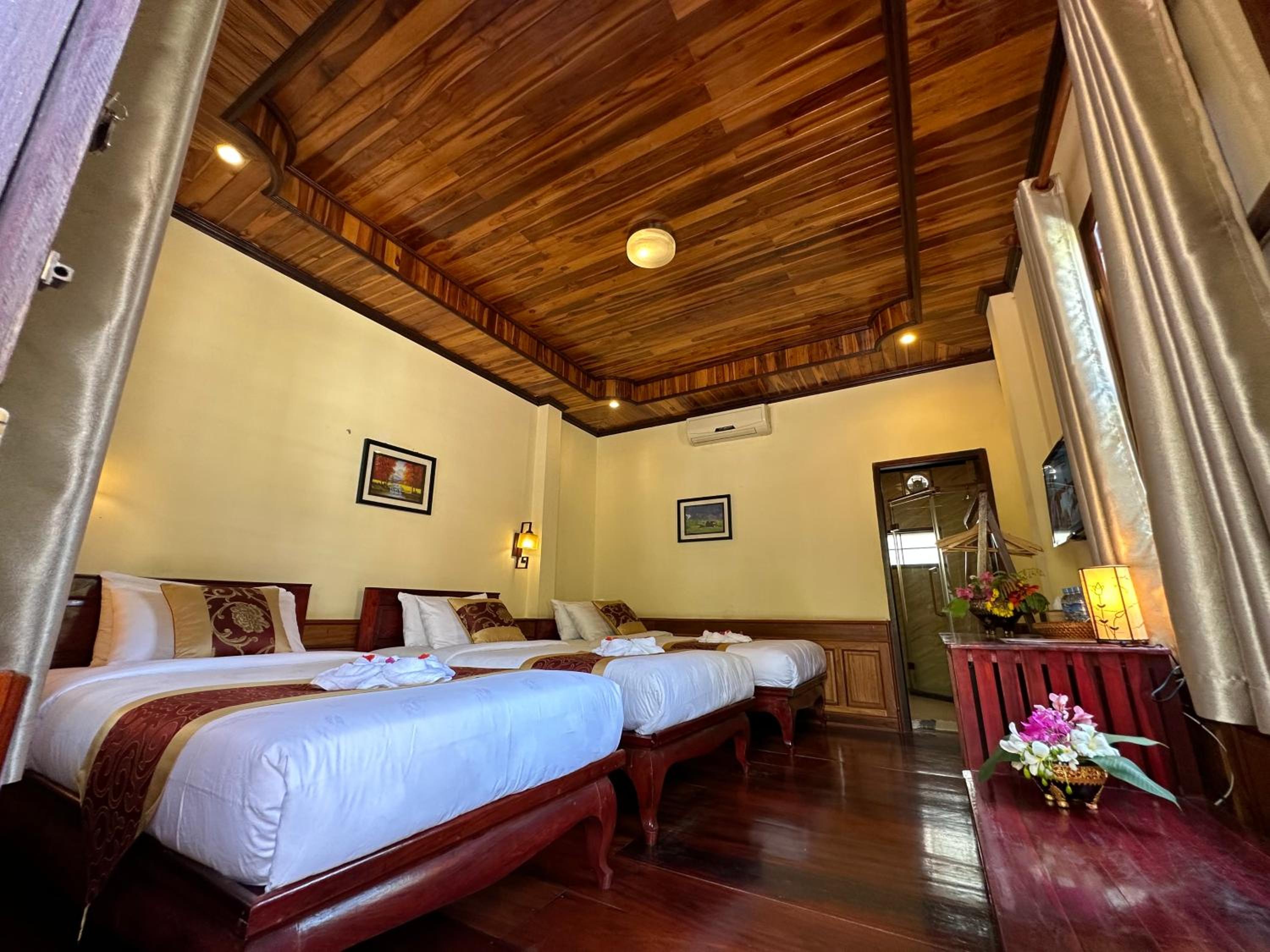 Deluxe Triple Room - Photo 11