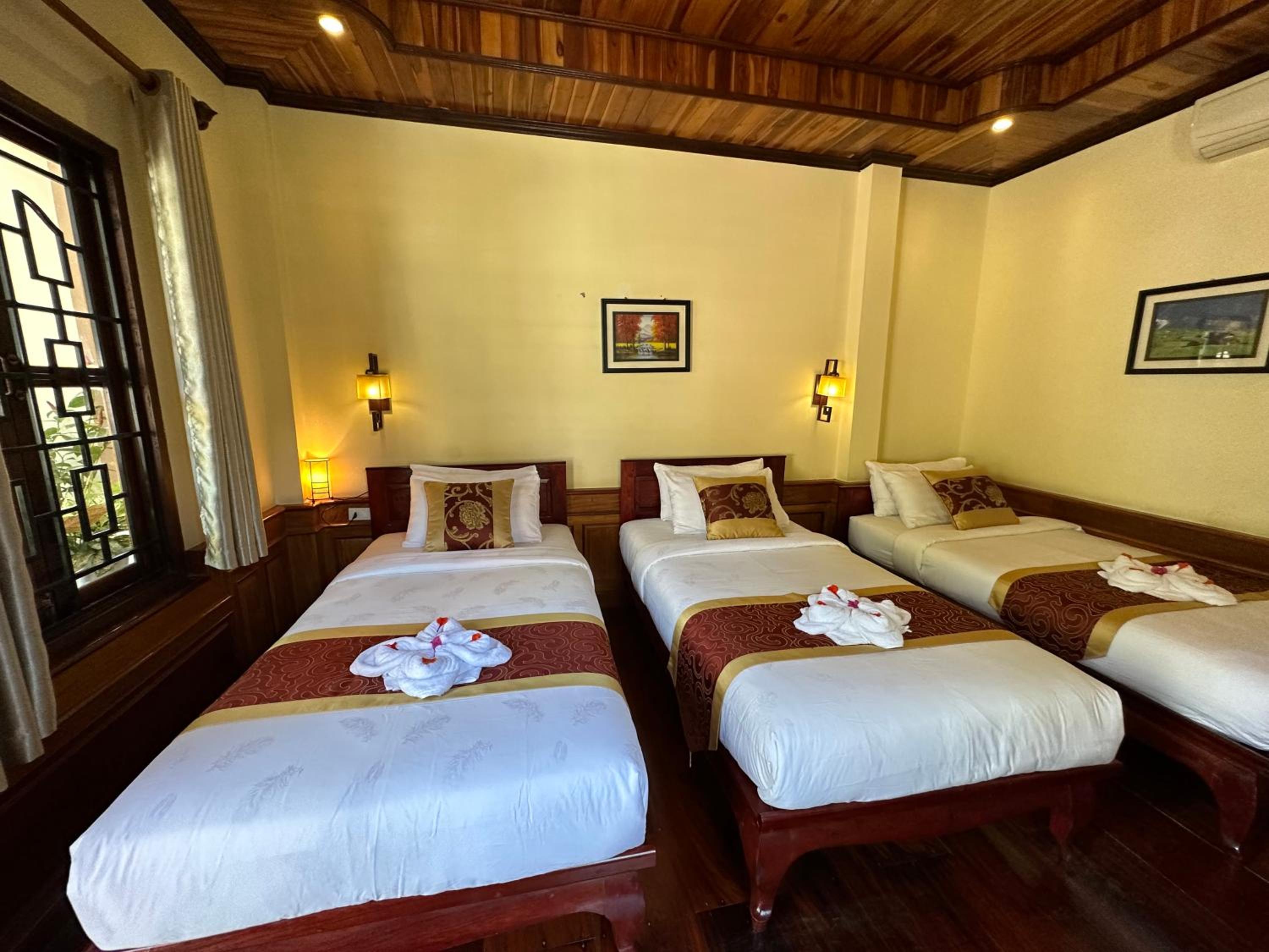 Deluxe Triple Room - Photo 12
