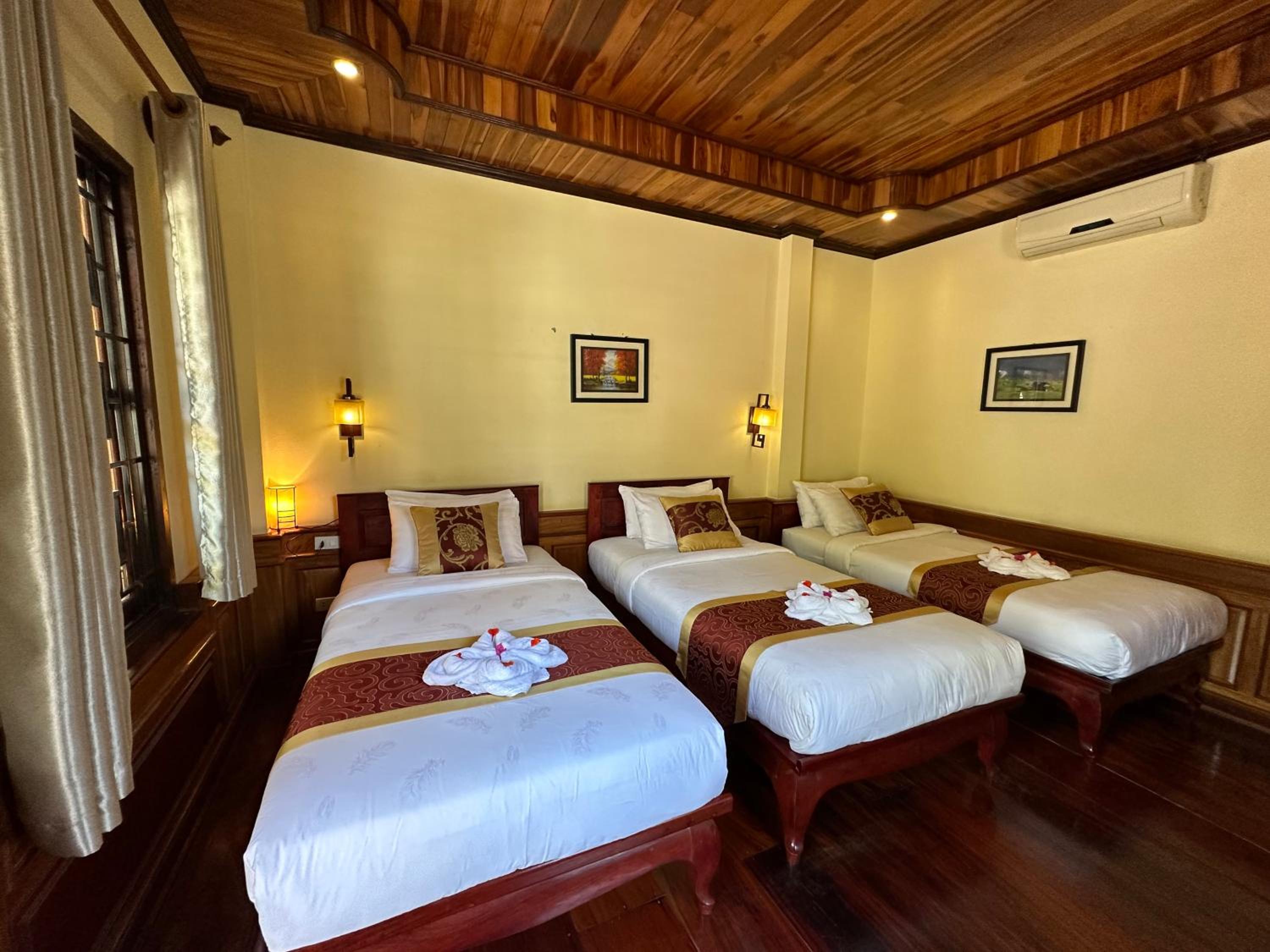 Deluxe Triple Room - Photo 13