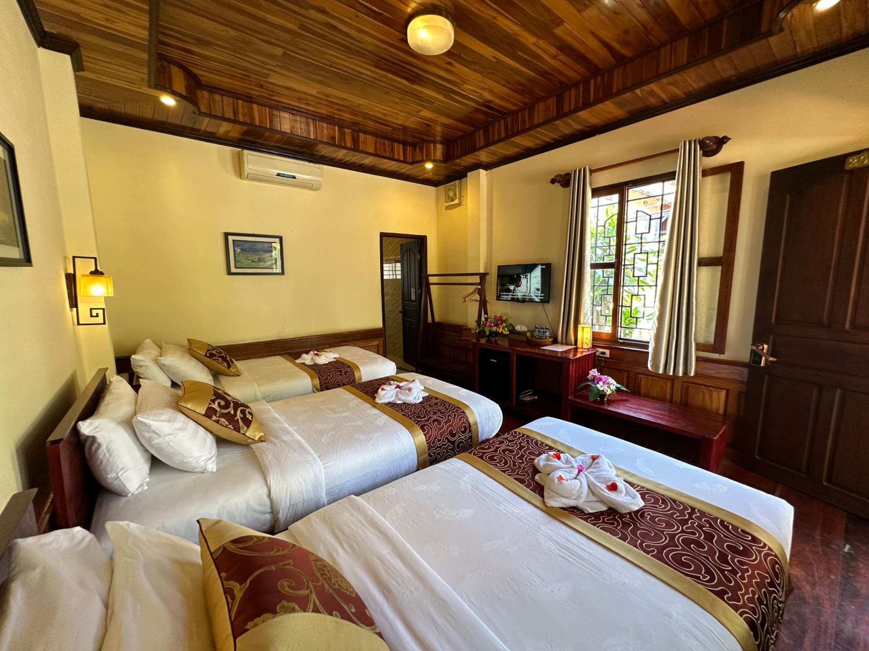 Deluxe Triple Room - Photo 14