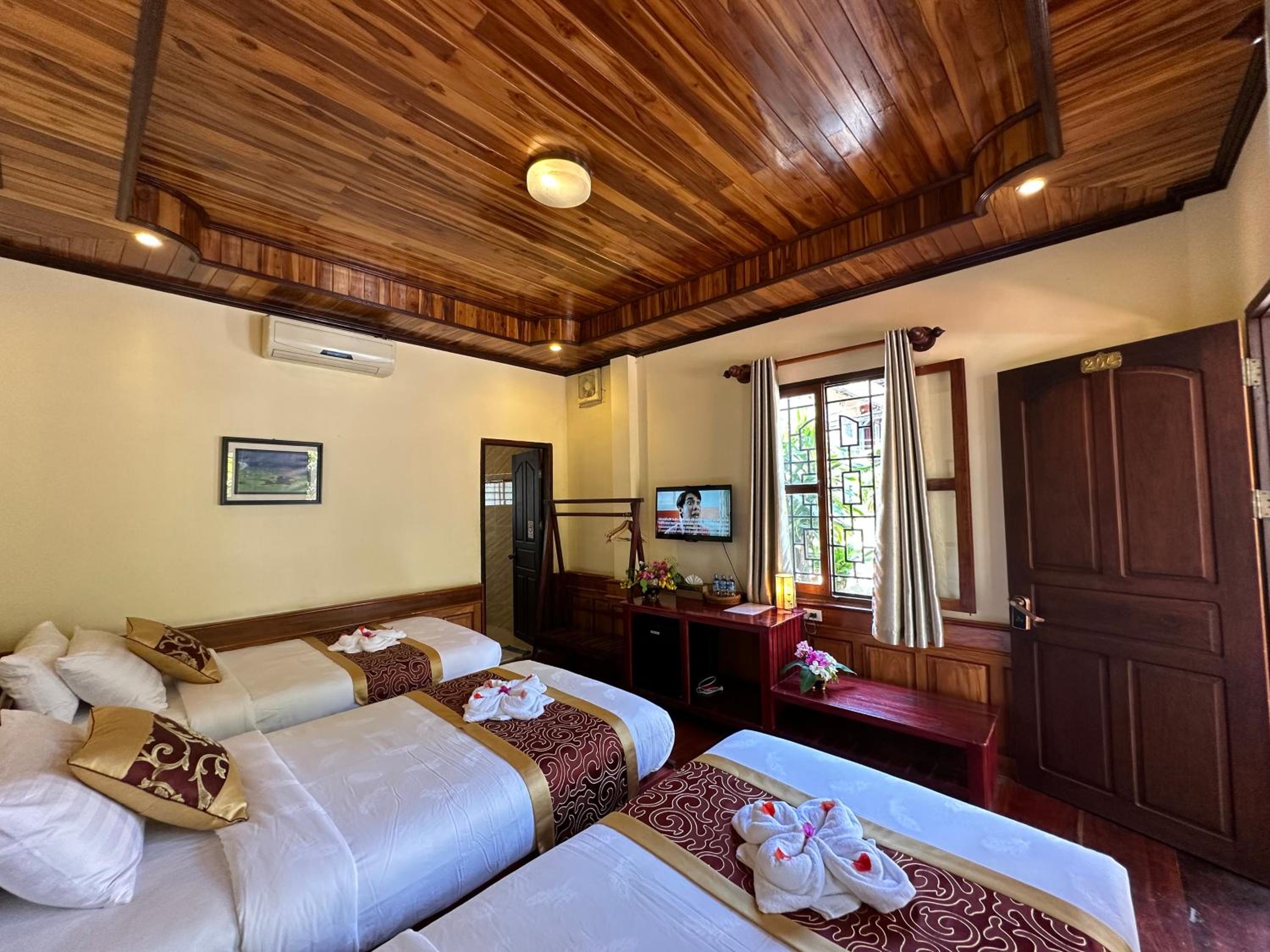 Deluxe Triple Room - Photo 10