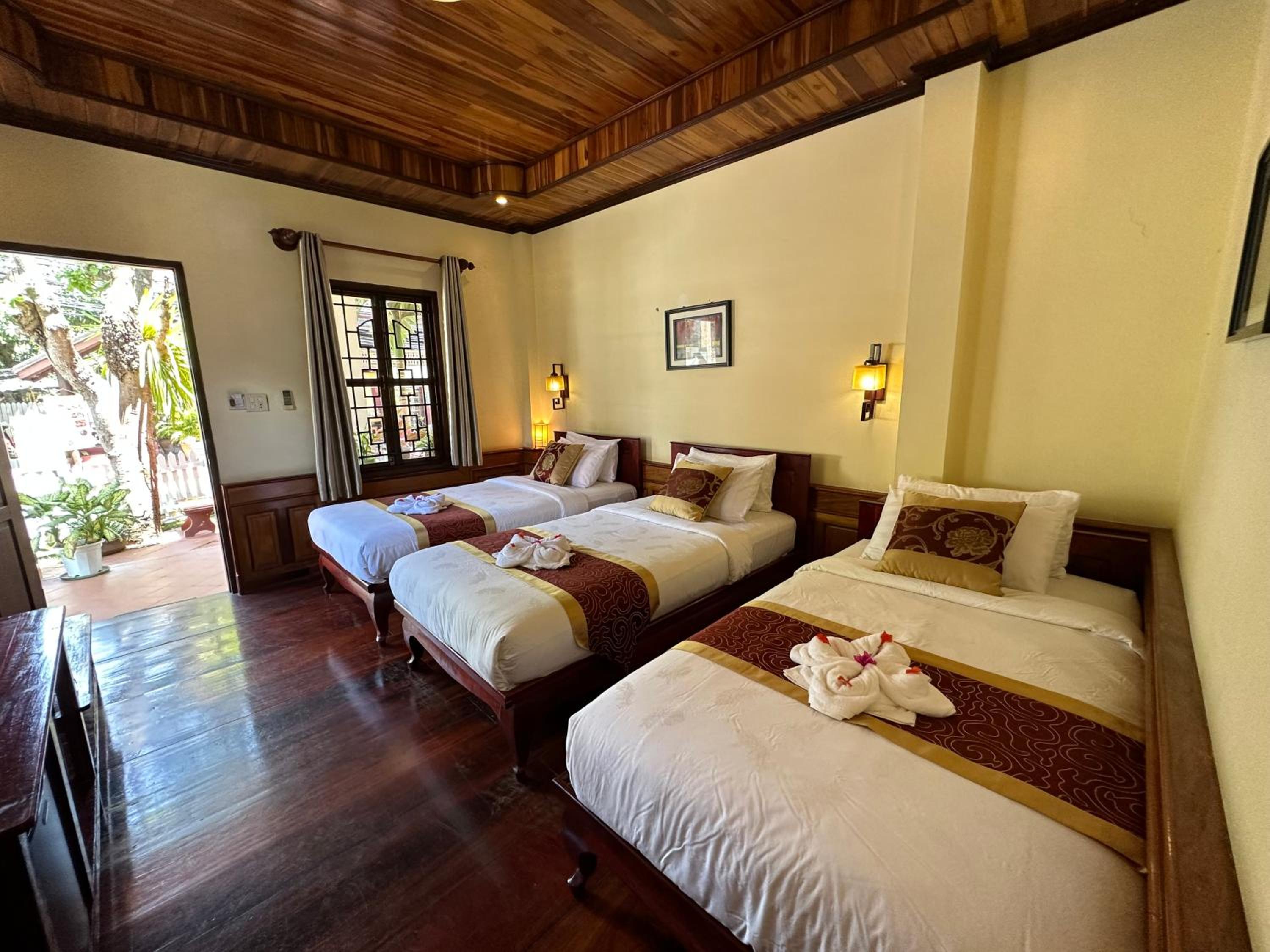 Deluxe Triple Room - Photo 15