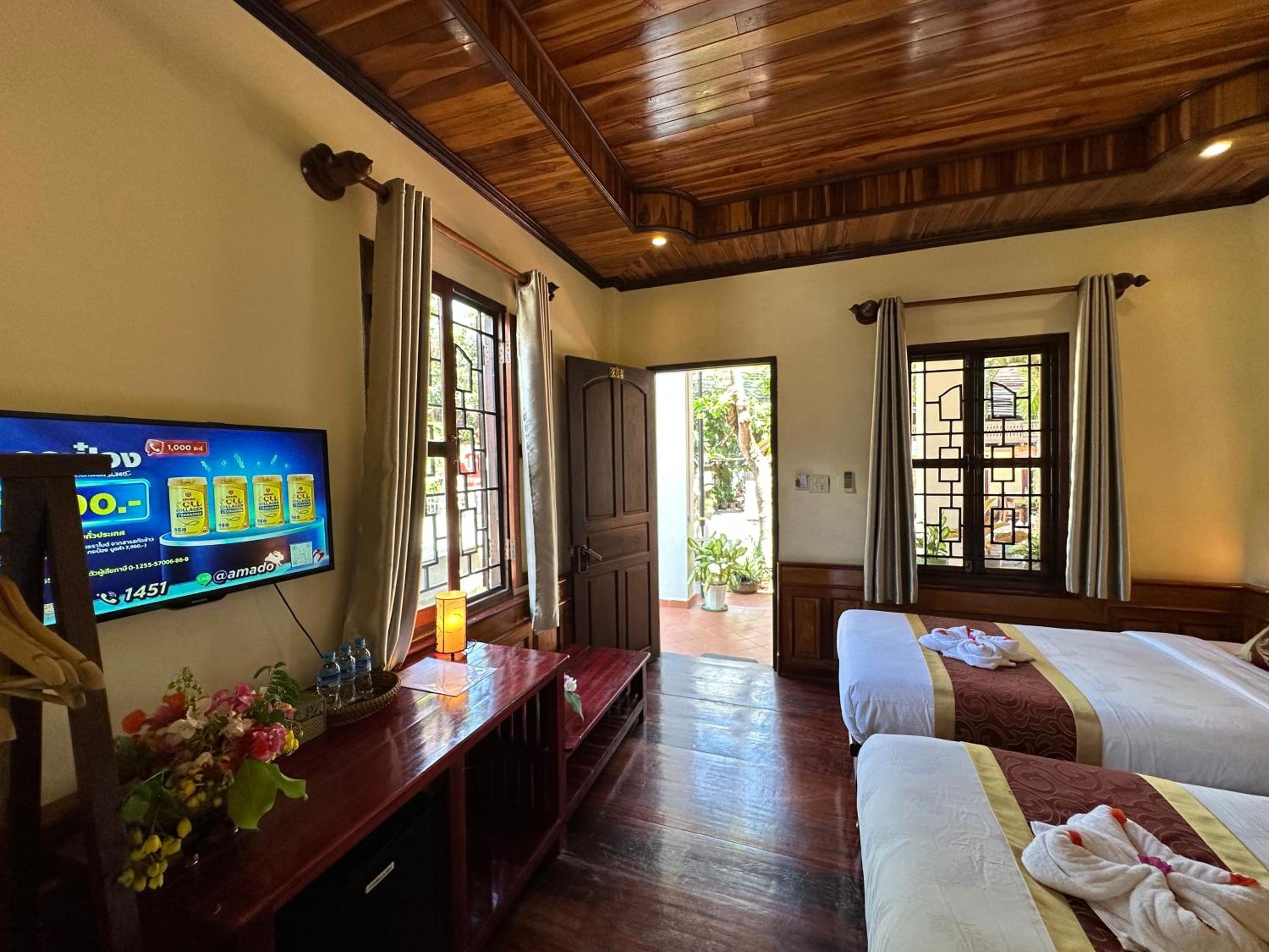 Deluxe Triple Room - Photo 9
