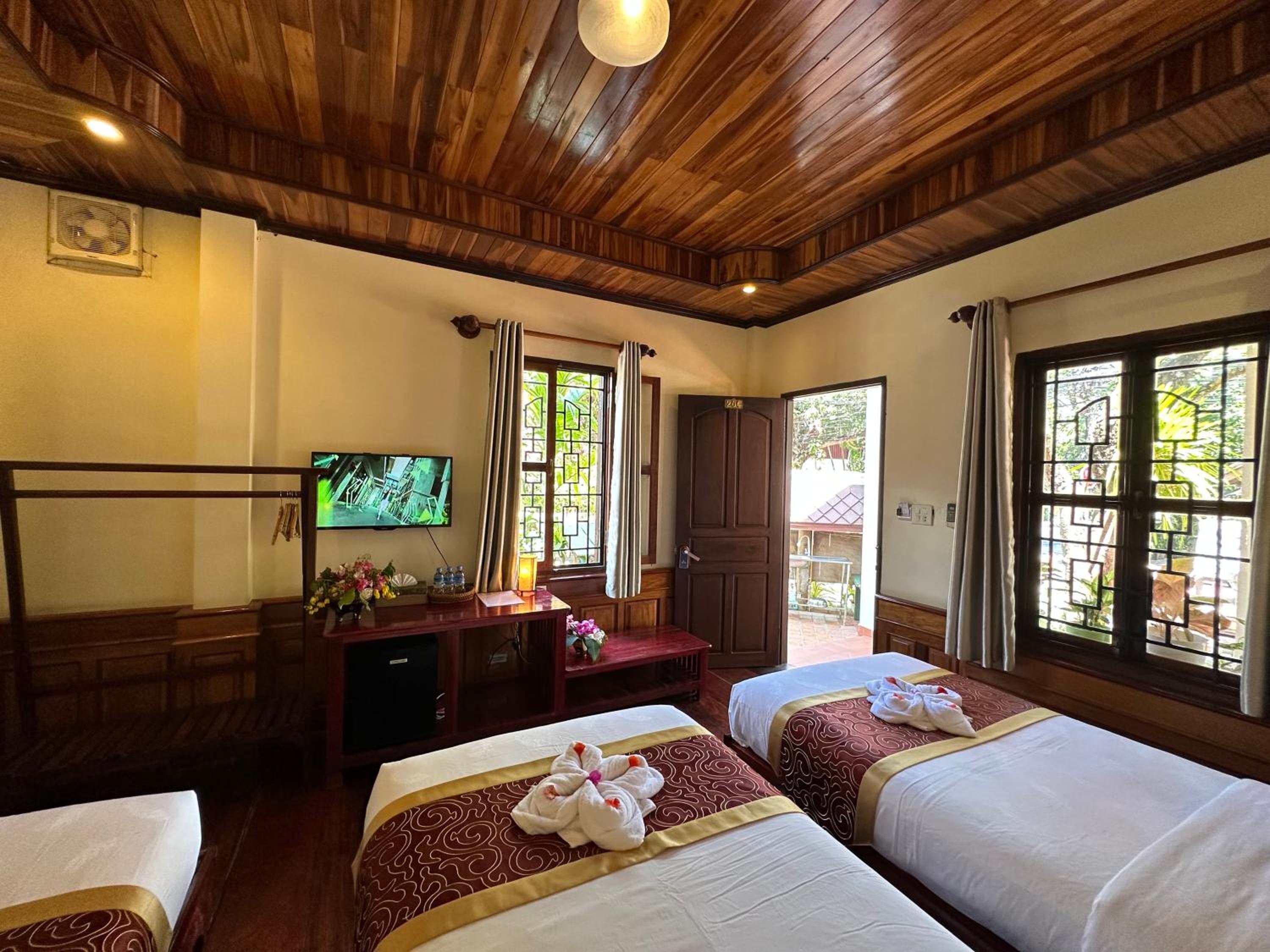 Deluxe Triple Room - Photo 8