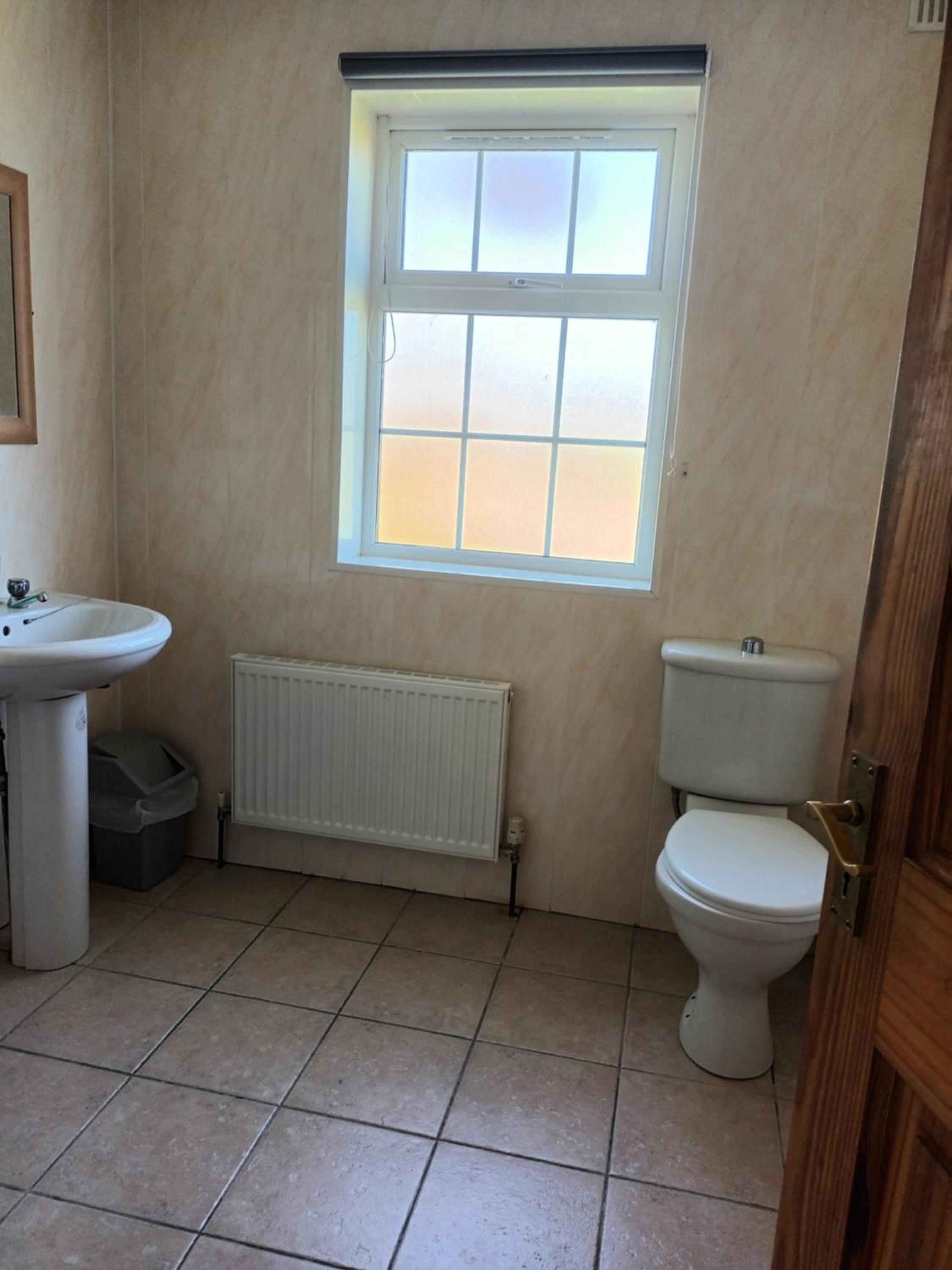 Three-Bedroom House - Photo 28