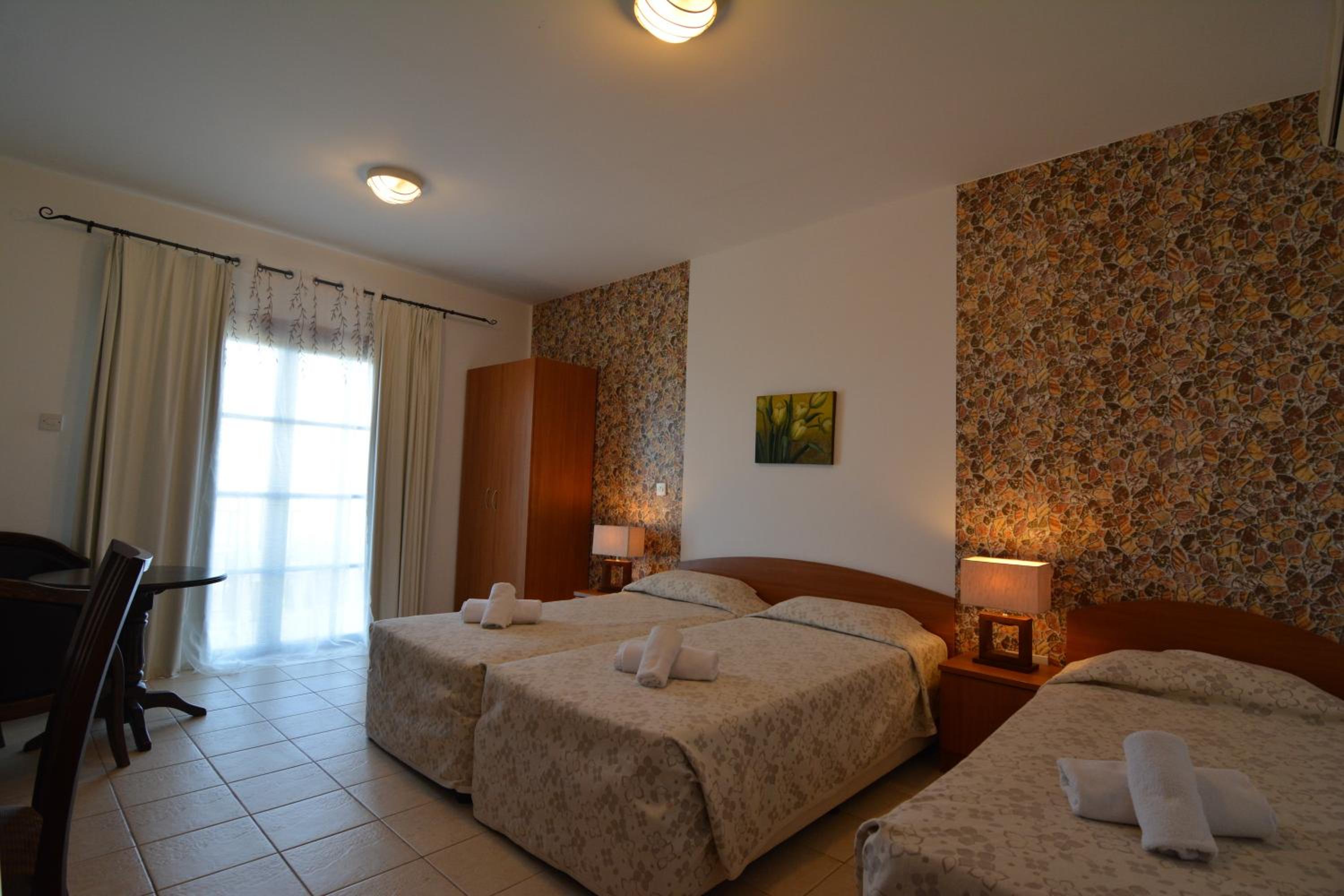 Dreibettzimmer mit Meerblick