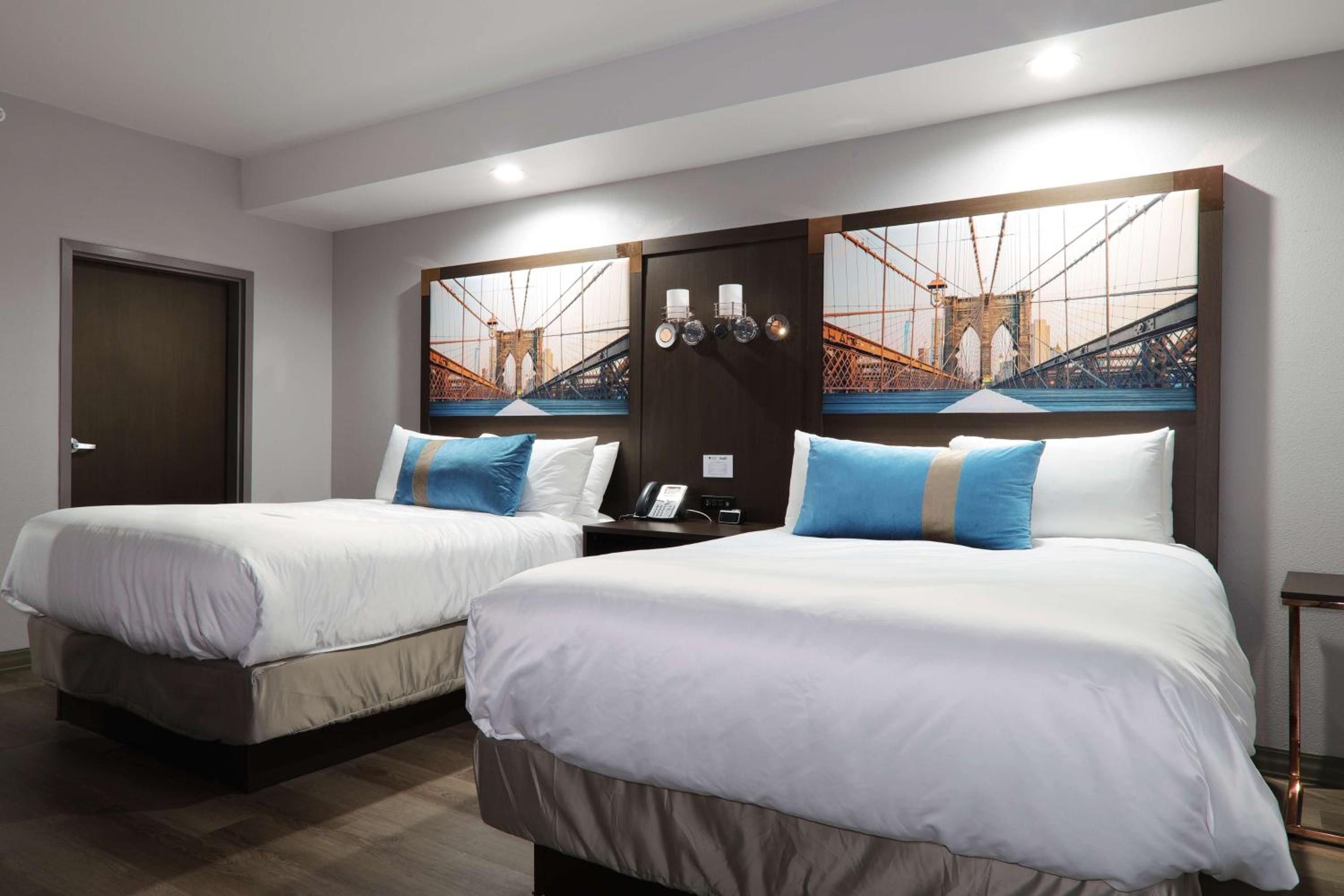 One-Bedroom Queen Suite with Two Queen Beds and Sofa Bed - Non-Smoking - Photo 1