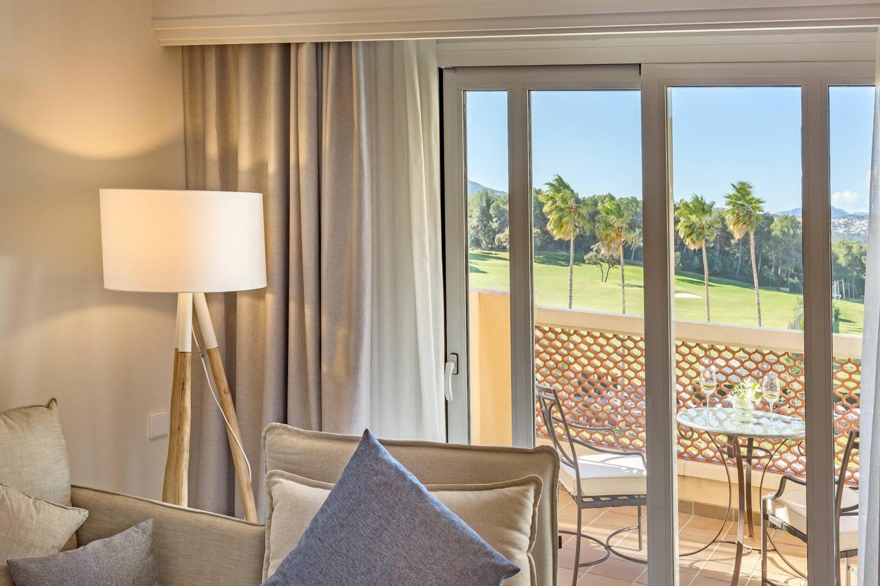 King Suite with Sofa Bed, Balcony and Resort View