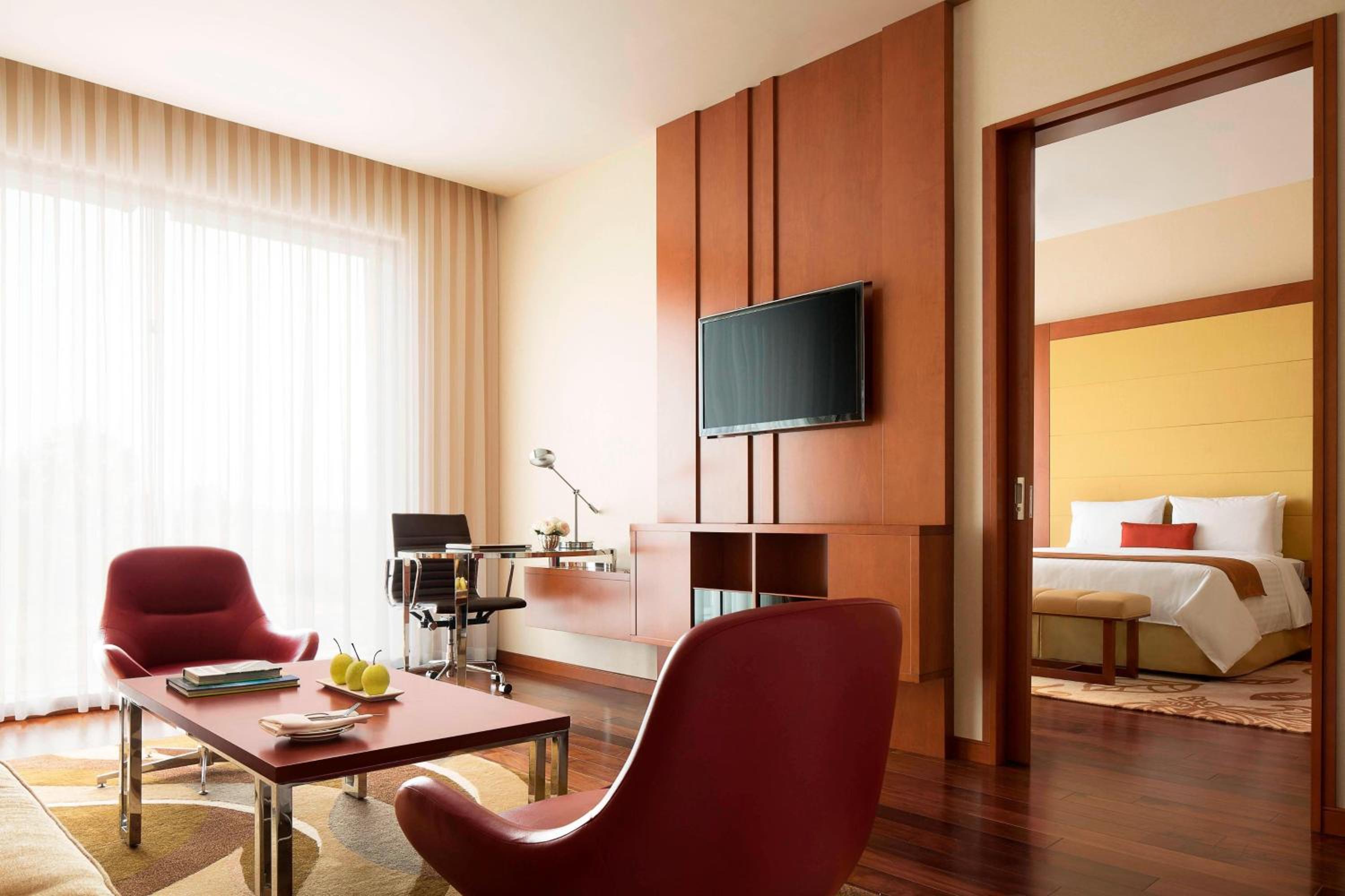 Deluxe Suite with complimentary airport transfers, Happy Hours, Executive Lounge Access.INR 500 hotel credit inclusive of IRD (In-Room Dining) per room per night Two way Airport Transfers Access to Taberna Bar with unlimited beverages for two hours (5PM – Deluxe Suite with complimentary airport transfers, Happy Hours, Executive Lounge Access.INR 500 hotel credit inclusive of IRD (In-Room Dining) per room per night Two way Airport Transfers Access to Taberna Bar with unlimited beverages for two hours (5PM –