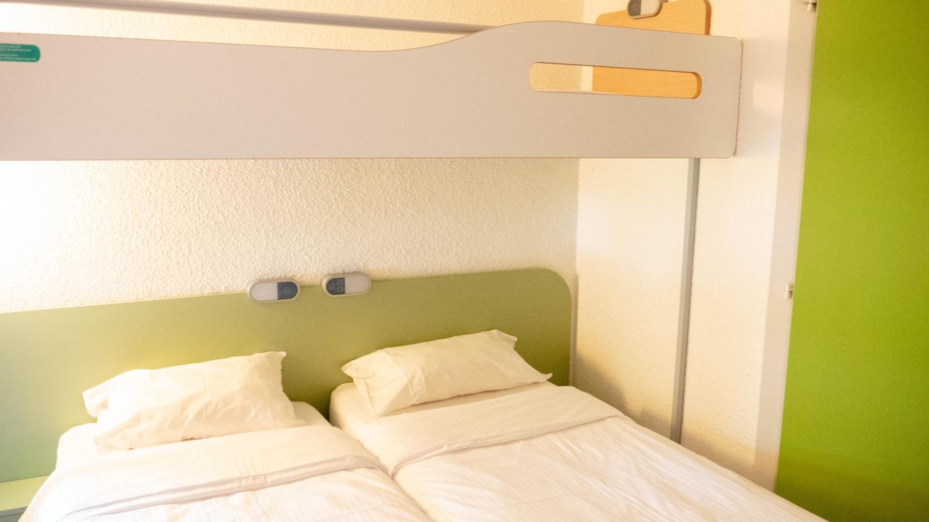 Triple Room with Two Single Beds and One Bunk Bed - Photo 1