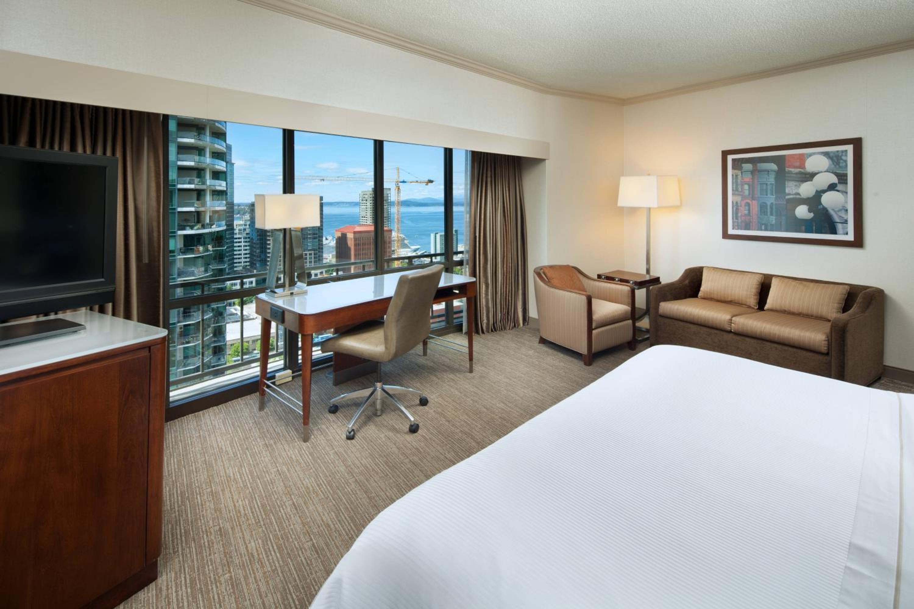 Premium, Guest room, 1 King, Sofa bed, Partial water view - Photo 1
