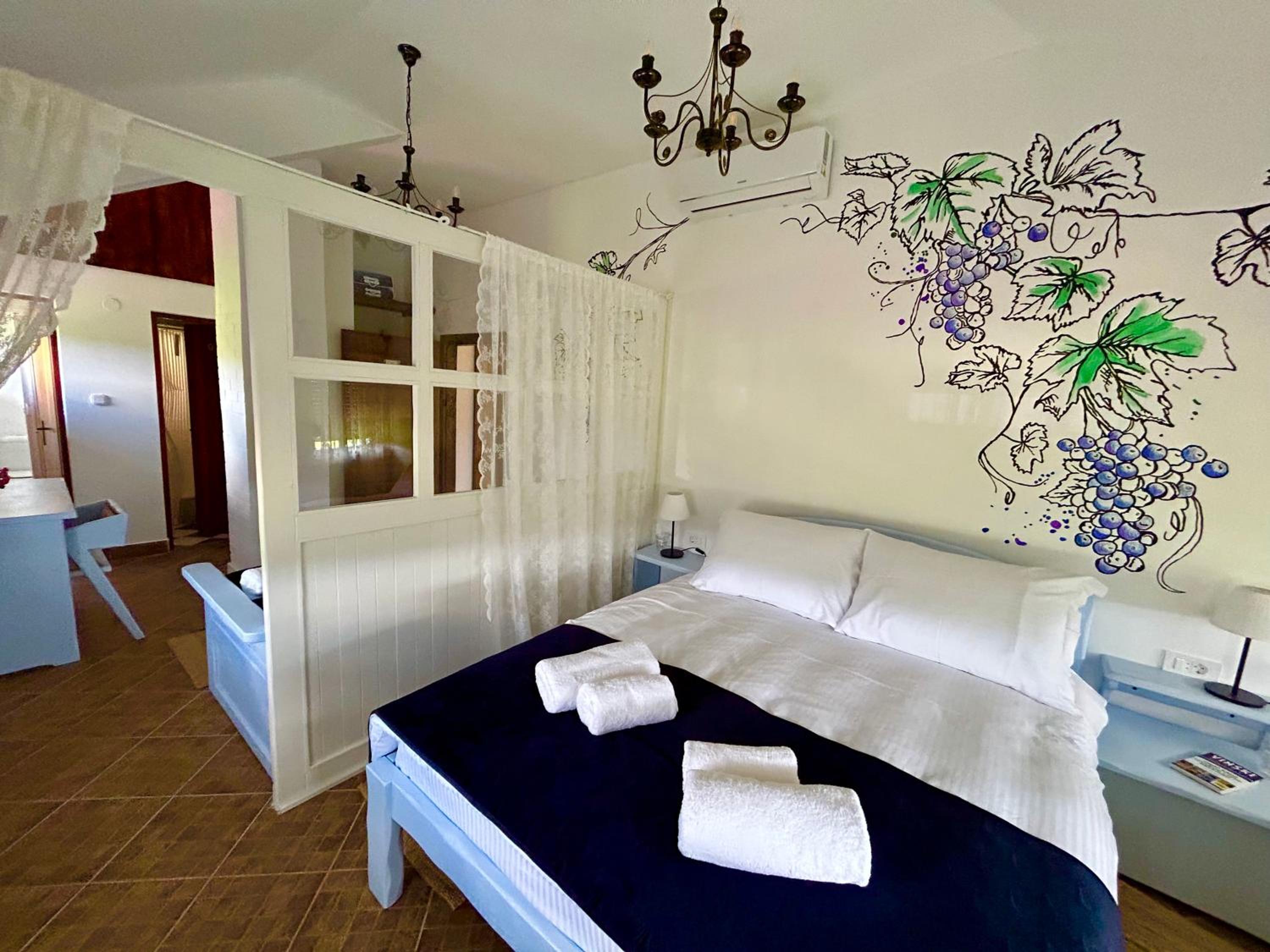 Deluxe Quadruple Room - Photo 1