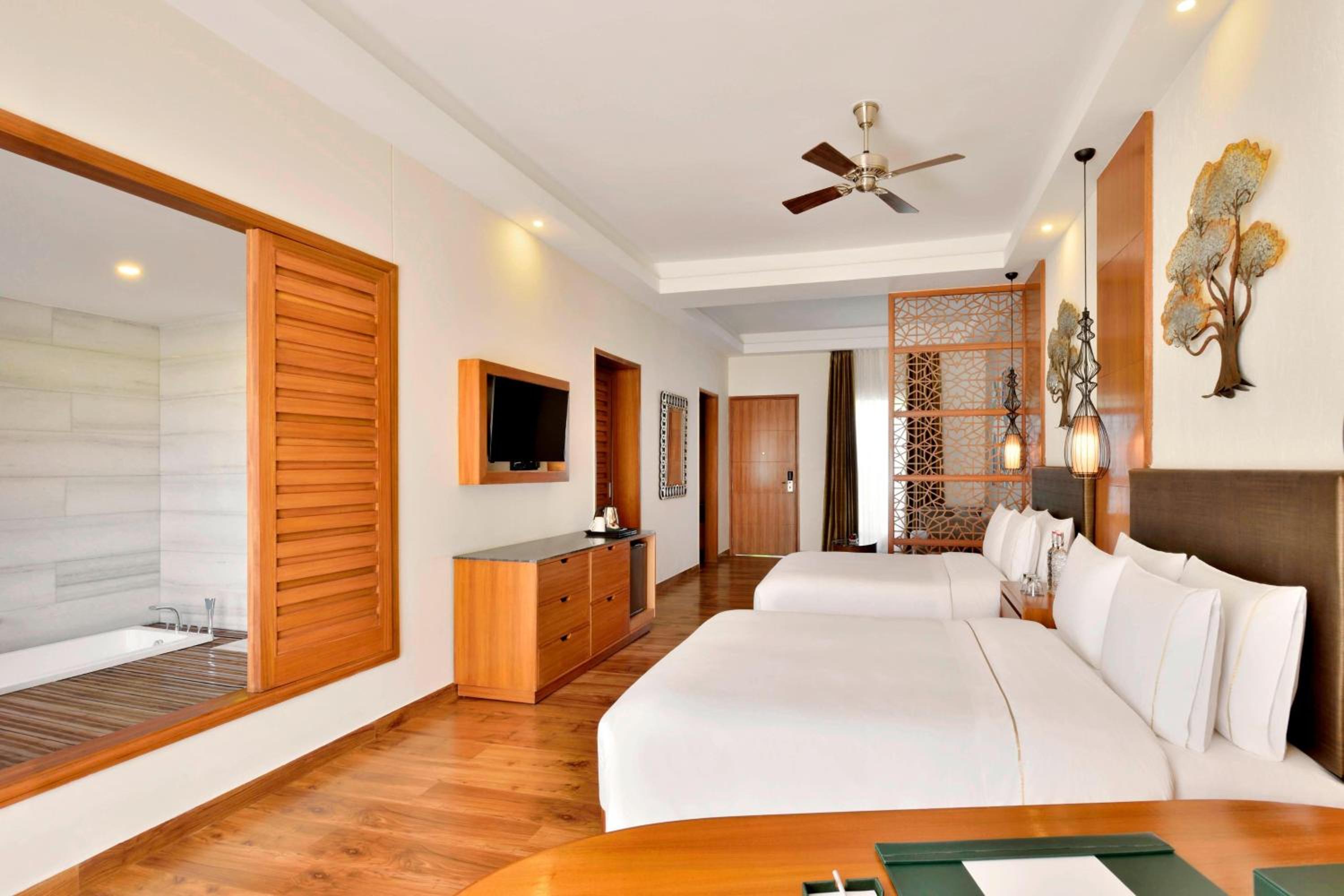 Twin Bedded Grand Villa with Balcony and Resort View - Watch 1 Complimentary movie at the in house theater, Early Check-in by 12:00Hrs and Late Check-out by 13:00Hrs (Subject to Availability)