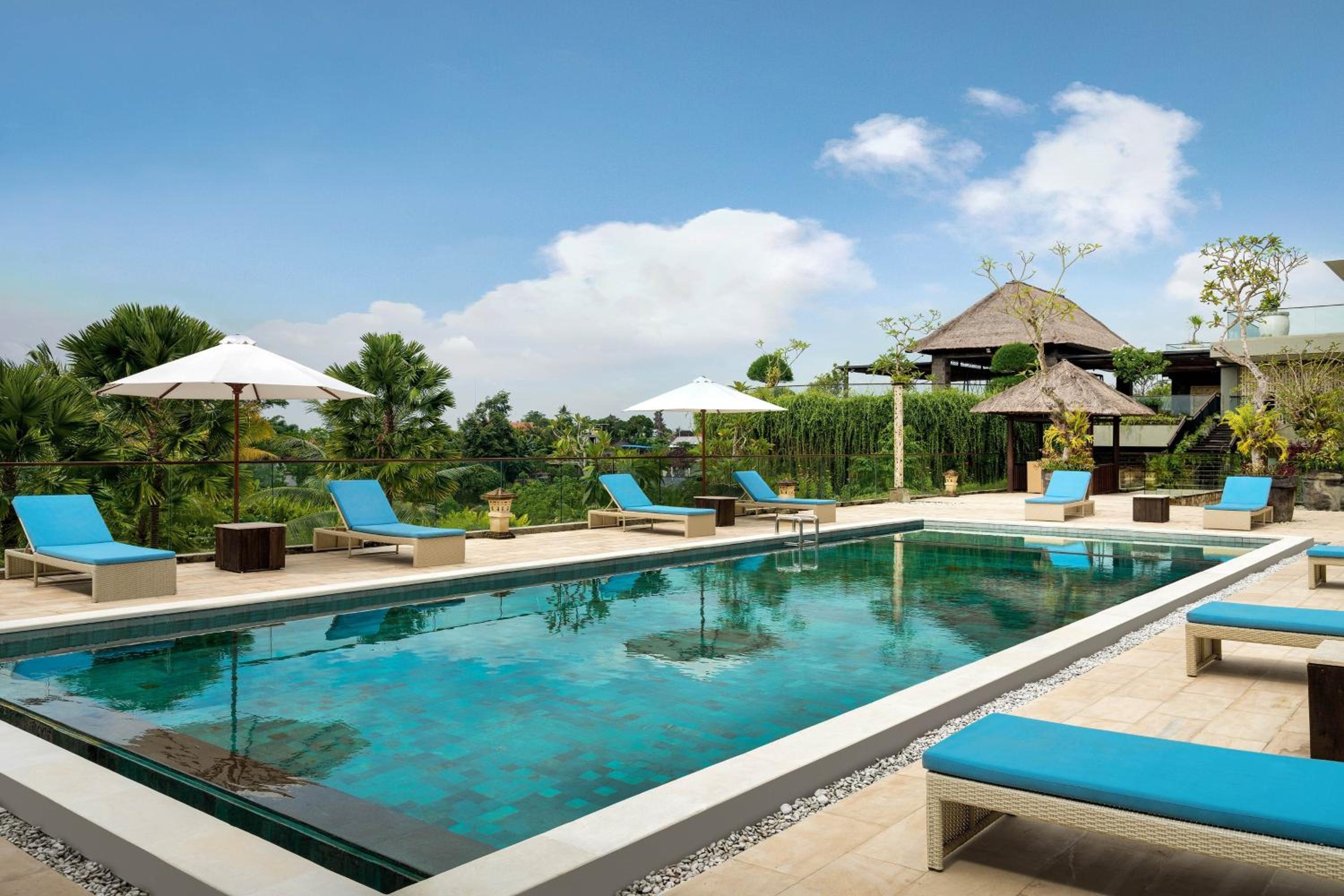 Deluxe King Balcony Room with Pool View, with FREE daily shuttle to Ubud City, FREE Photo Session, FREE Art Gallery Visit, 24-hour access to Fitness Center, FREE Welcome Drink, and FREE Kids Activities. photo 2