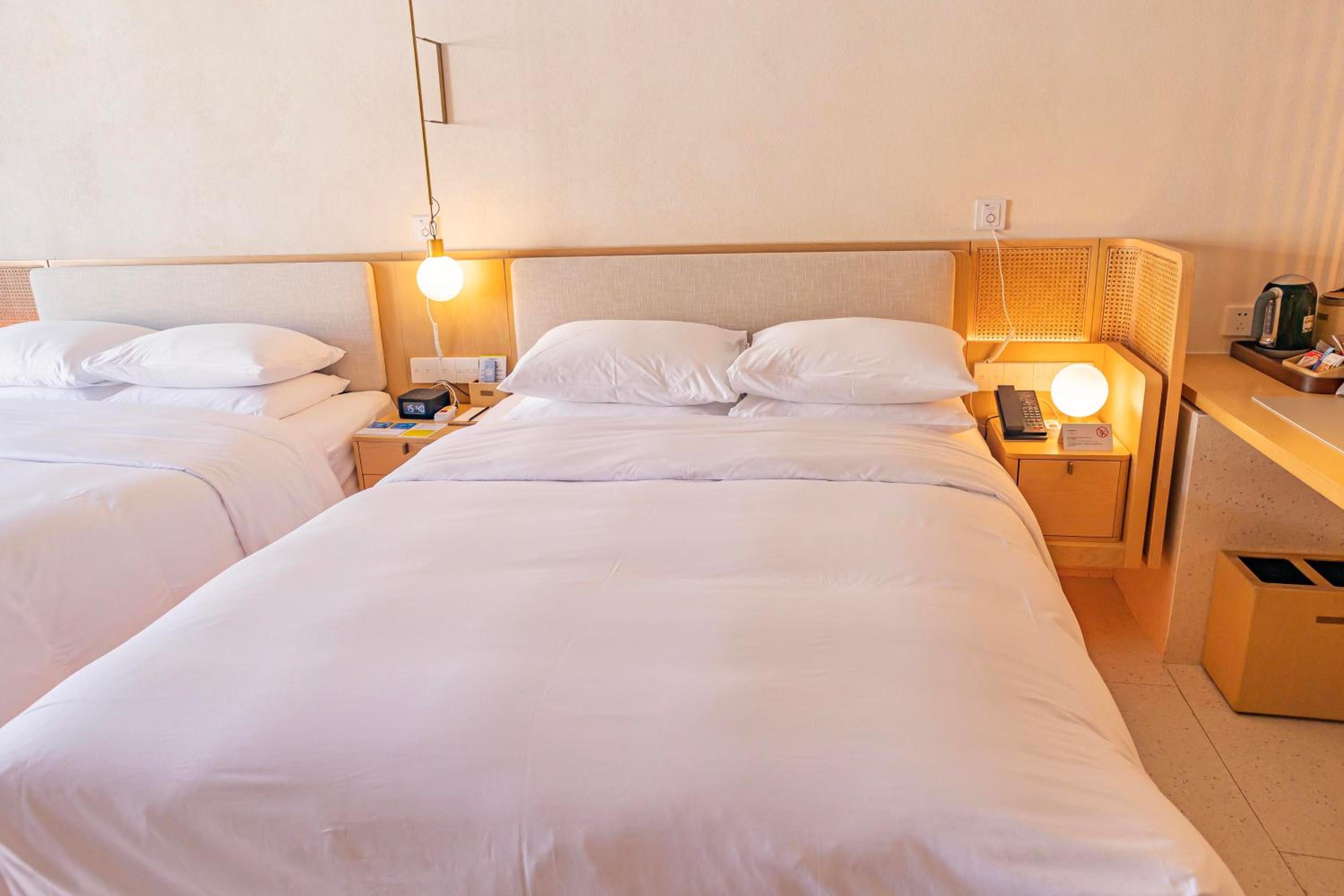 Elderly Deluxe Queen Room with Two Queen Beds and Balcony - Photo 1