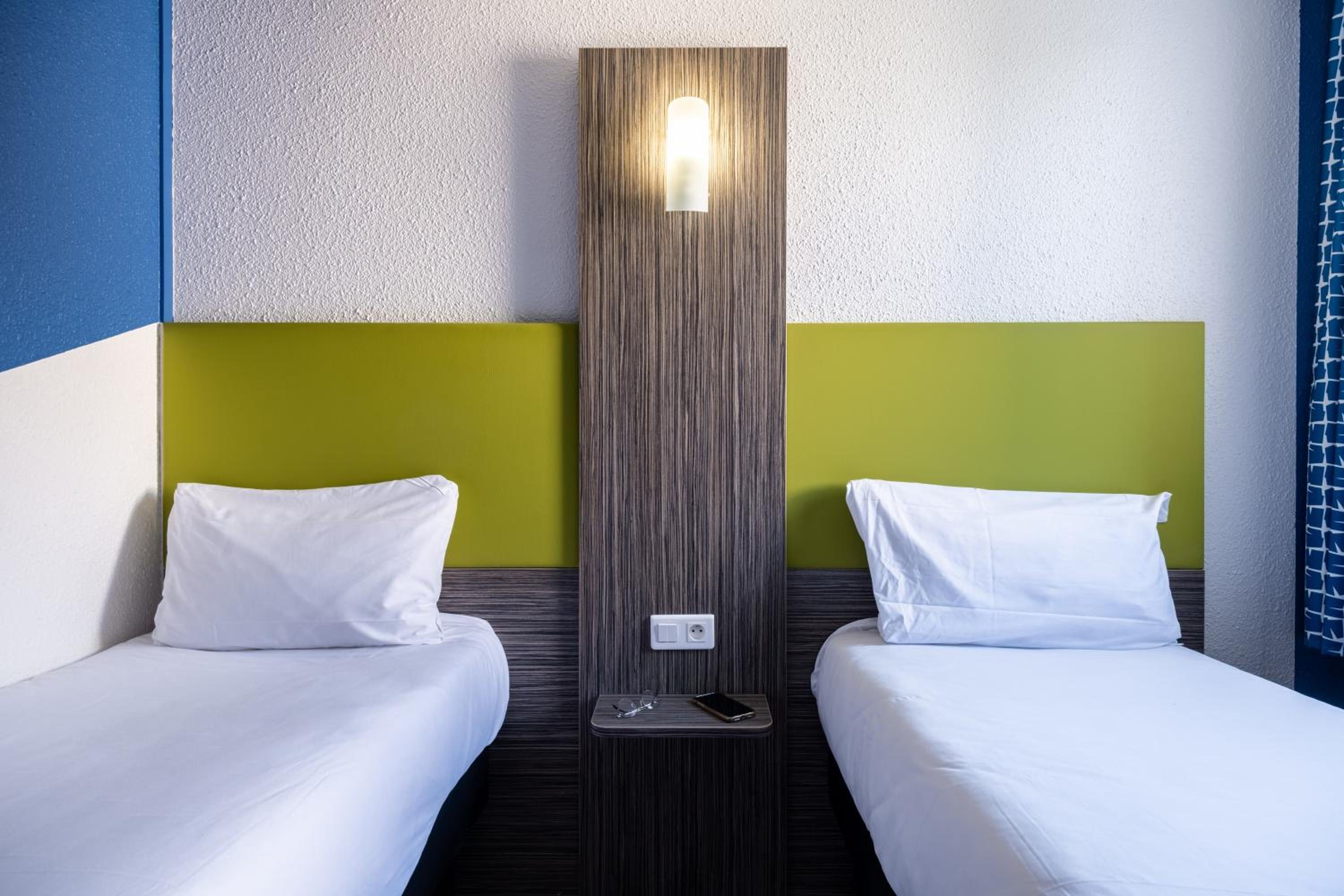 Single Pop Room with Two Single Beds