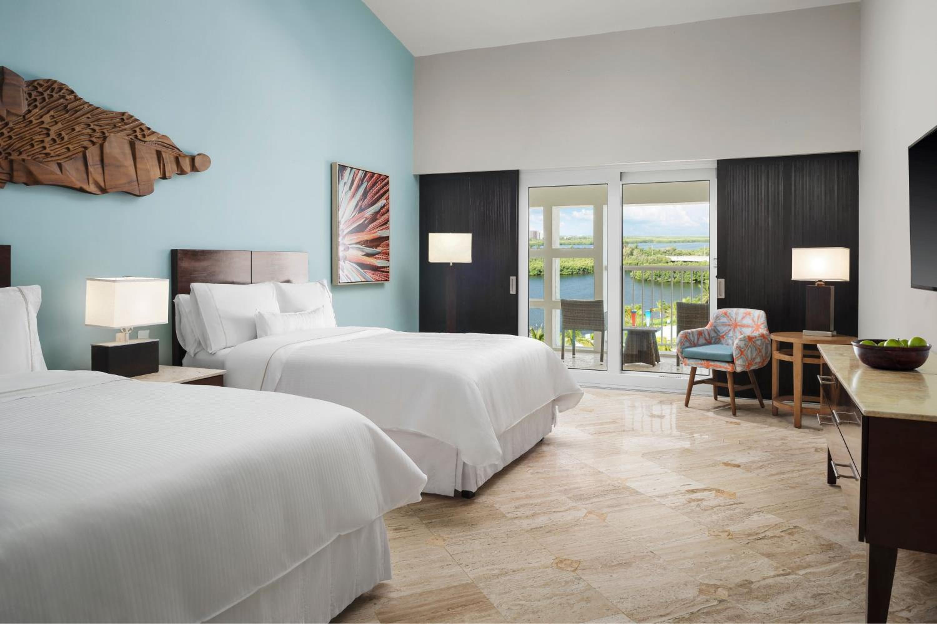 Deluxe Double Room with Two Double Beds, Balcony and Lagoon View - Photo 1