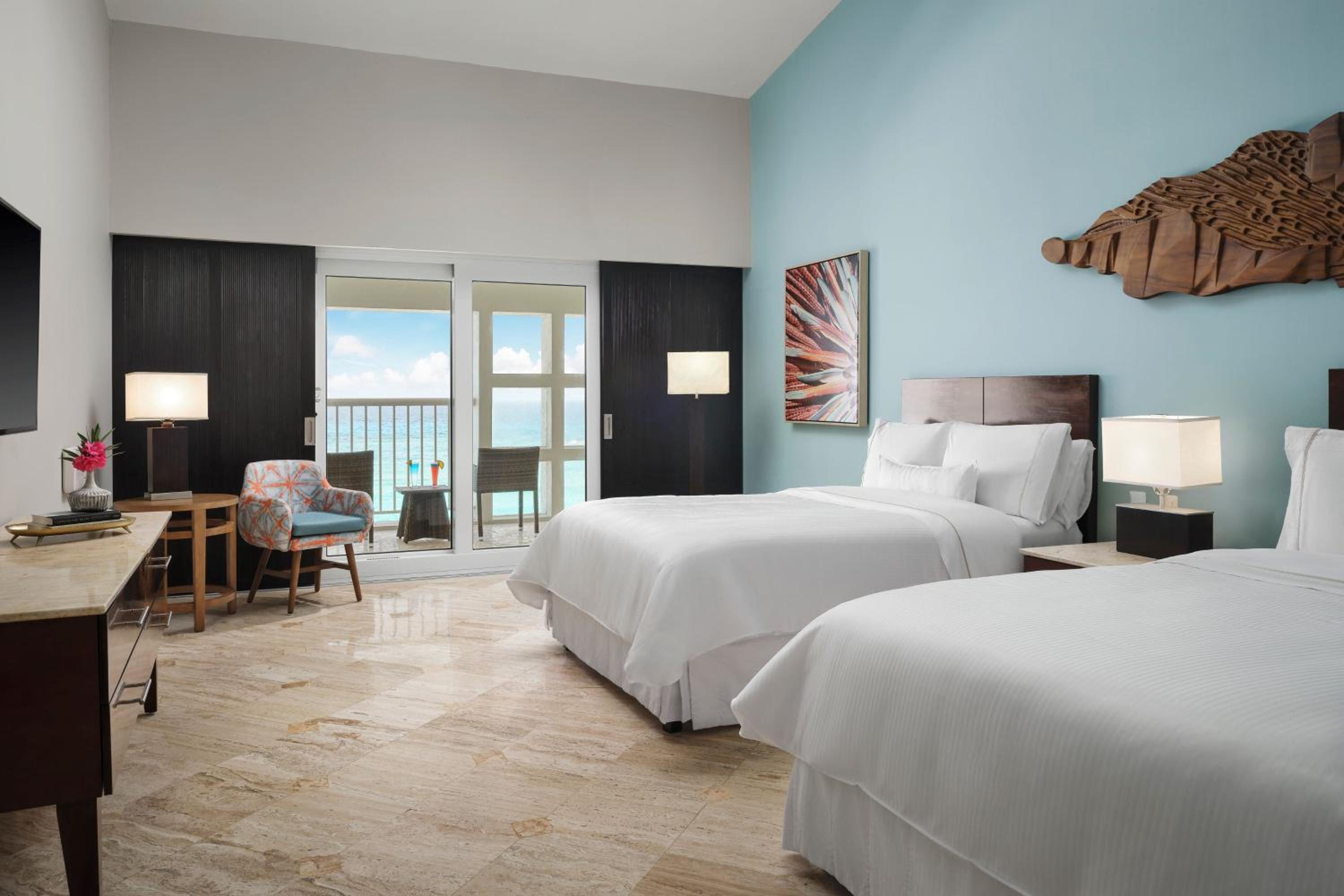 Chambre Double Deluxe avec 2 Lits Doubles et Balcon - Vue sur Océan