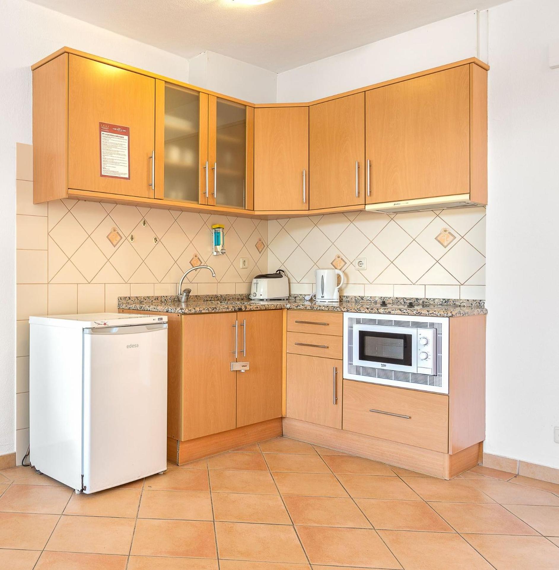 Cozy kitchen for delightful meal preparations.