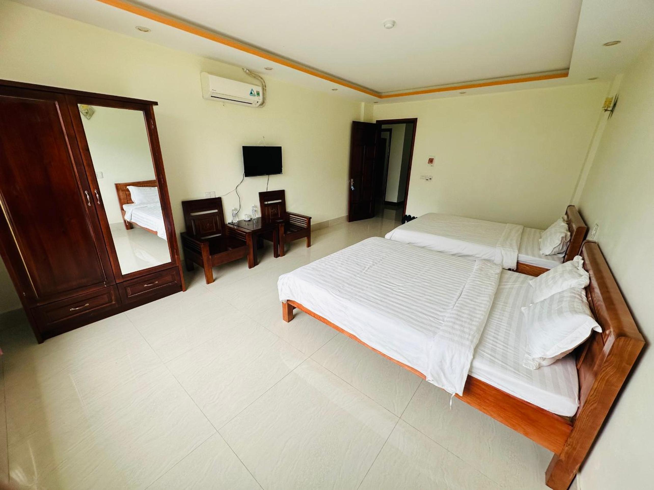 Deluxe Queen Room with Two Queen Beds - Photo 1
