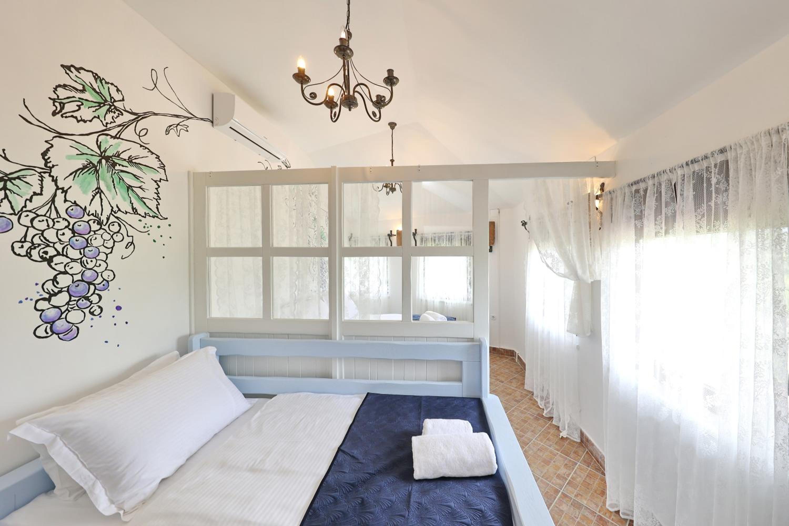 Deluxe Quadruple Room - Photo 7