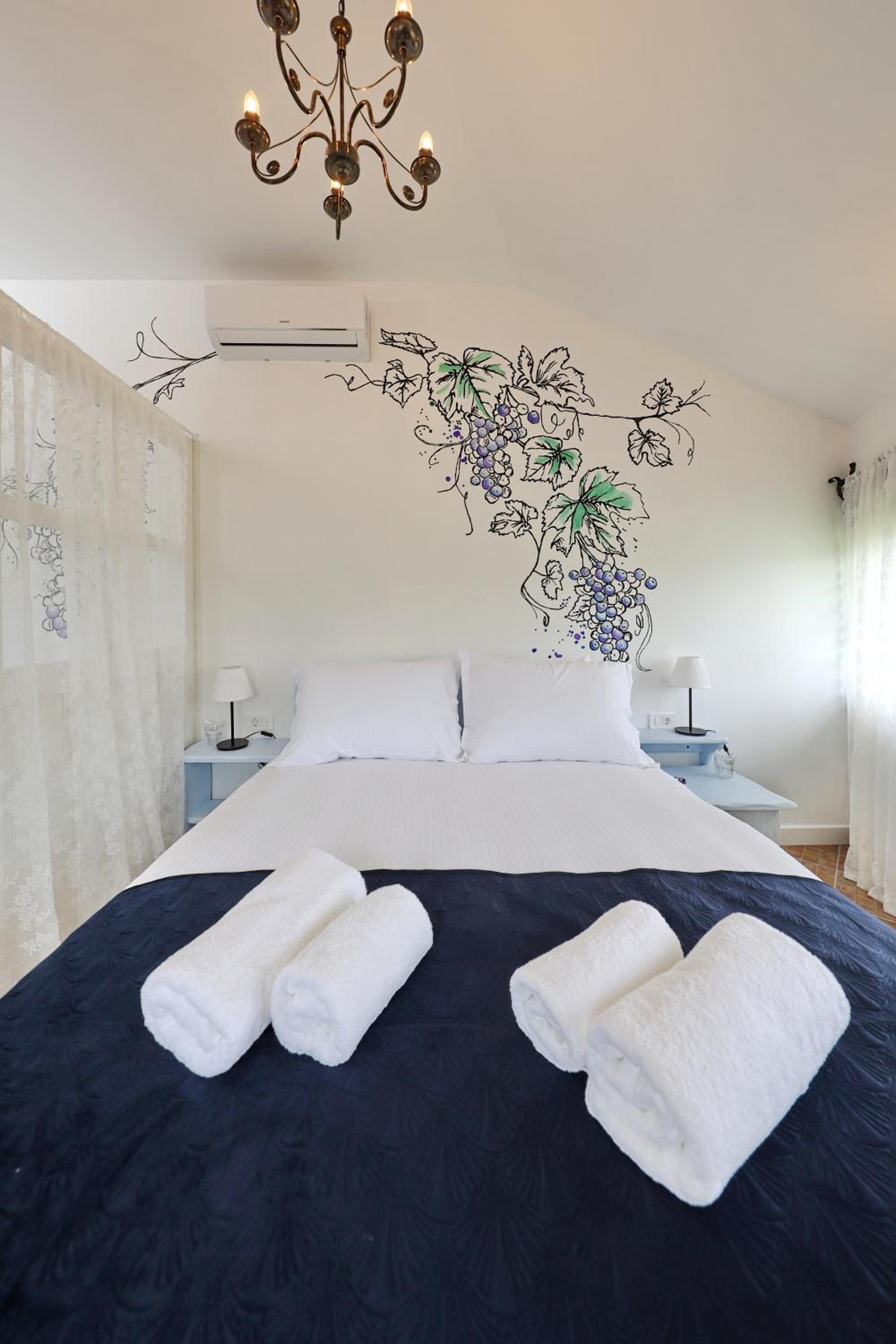 Deluxe Quadruple Room - Photo 27