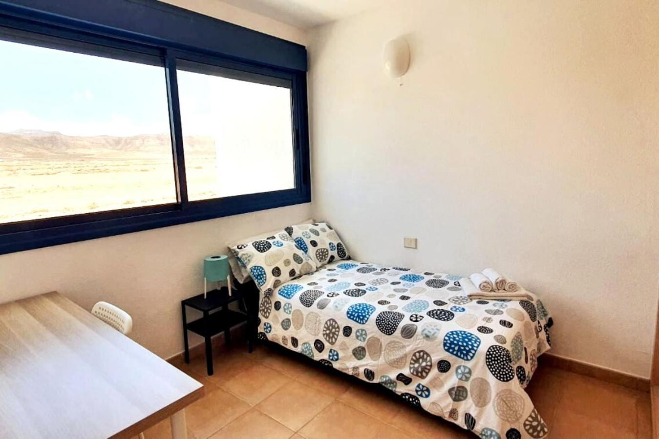 Habitación individual con baño compartido