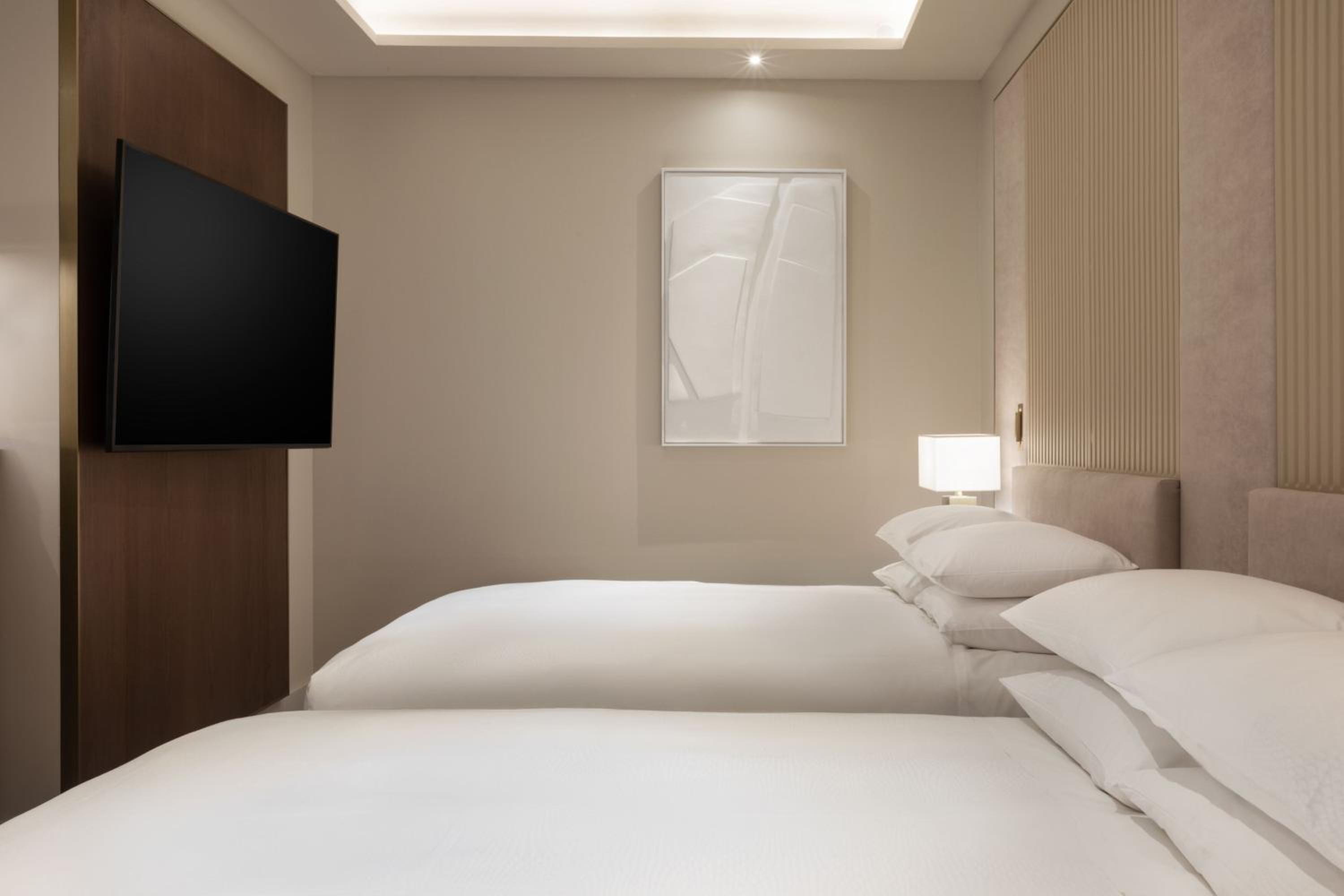 Deluxe Queen Room with Two Queen Beds and Courtyard View