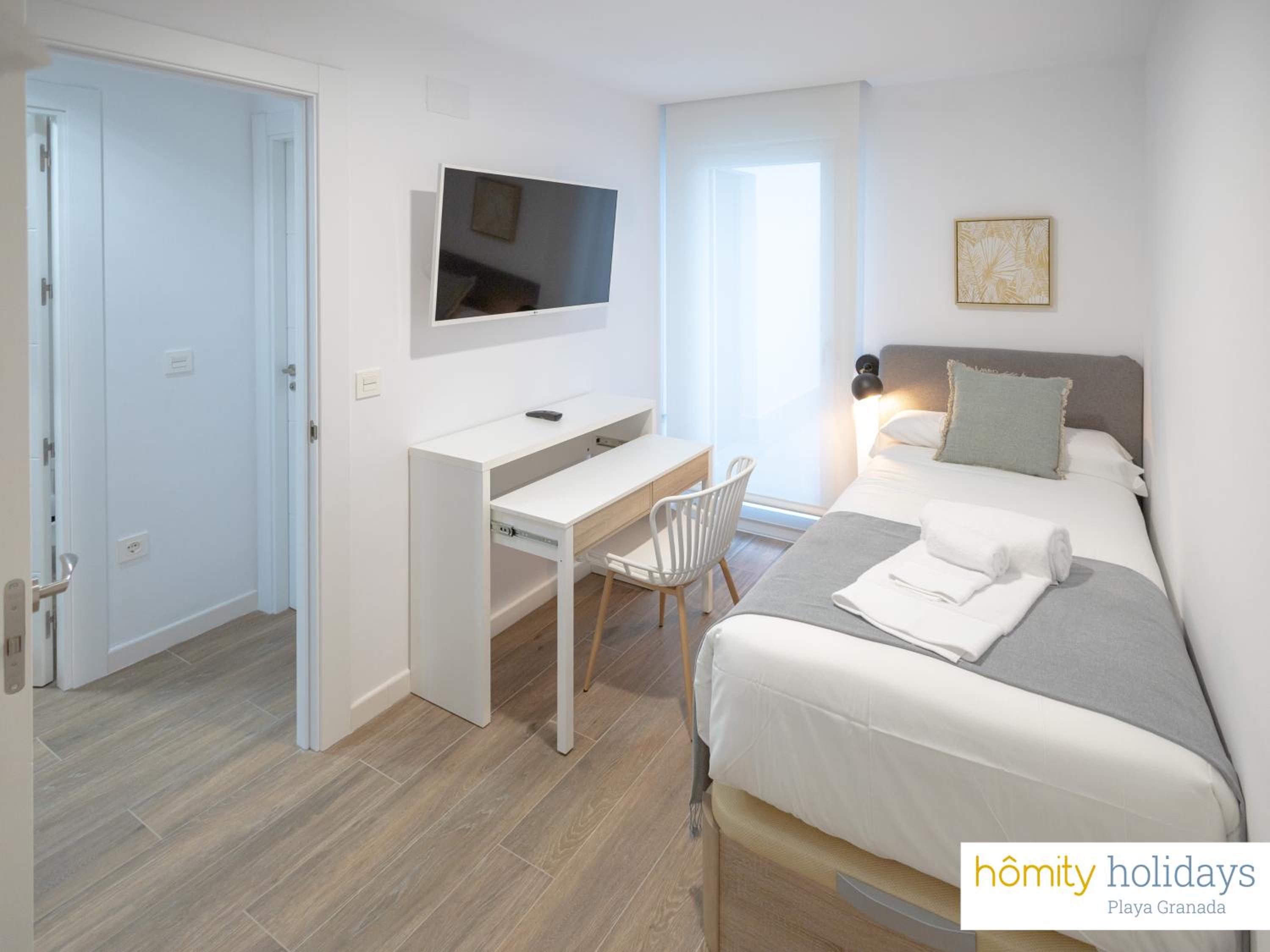 Apartamento de lujo con vista a la piscina y al jardín