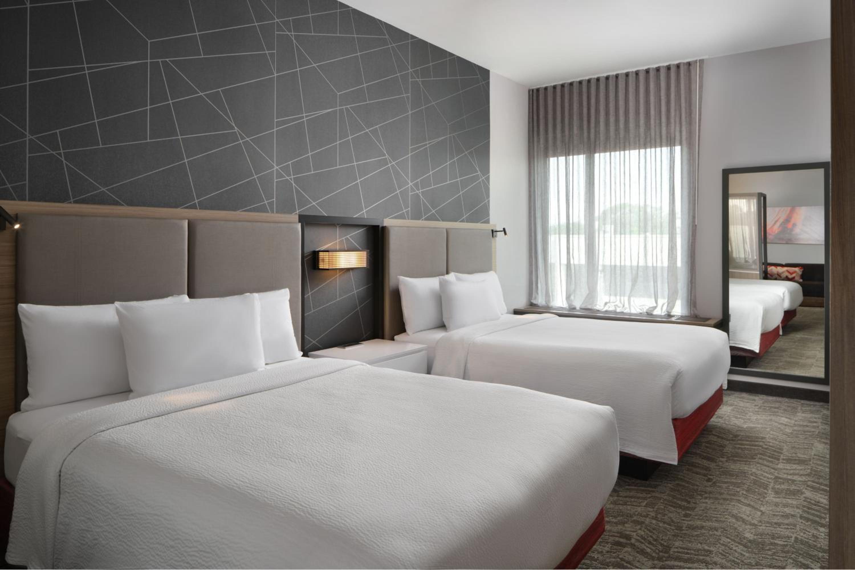 Queen Suite with Two Queen Beds and Sofa Bed - Photo 1