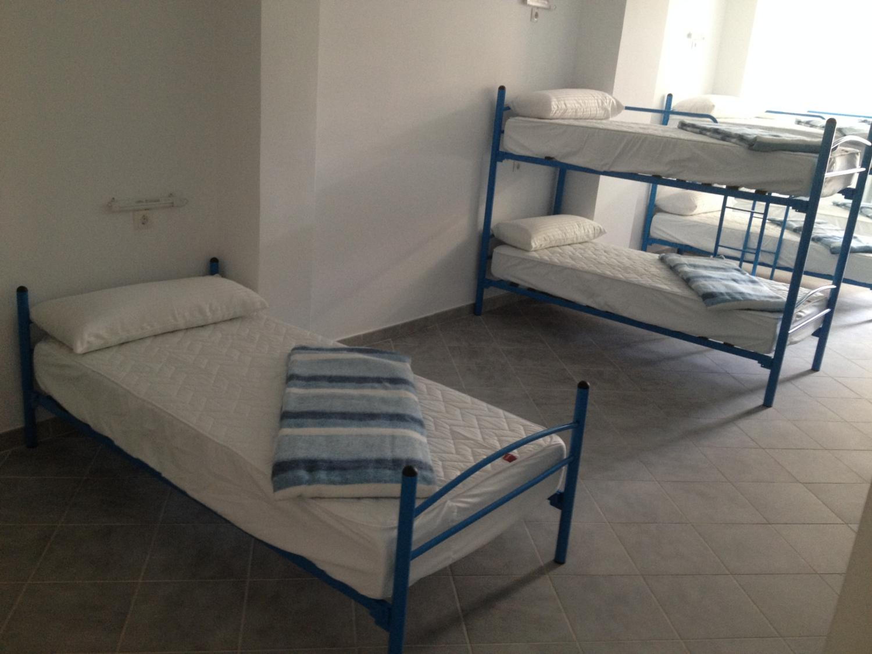 Cama individual en habitación compartida
