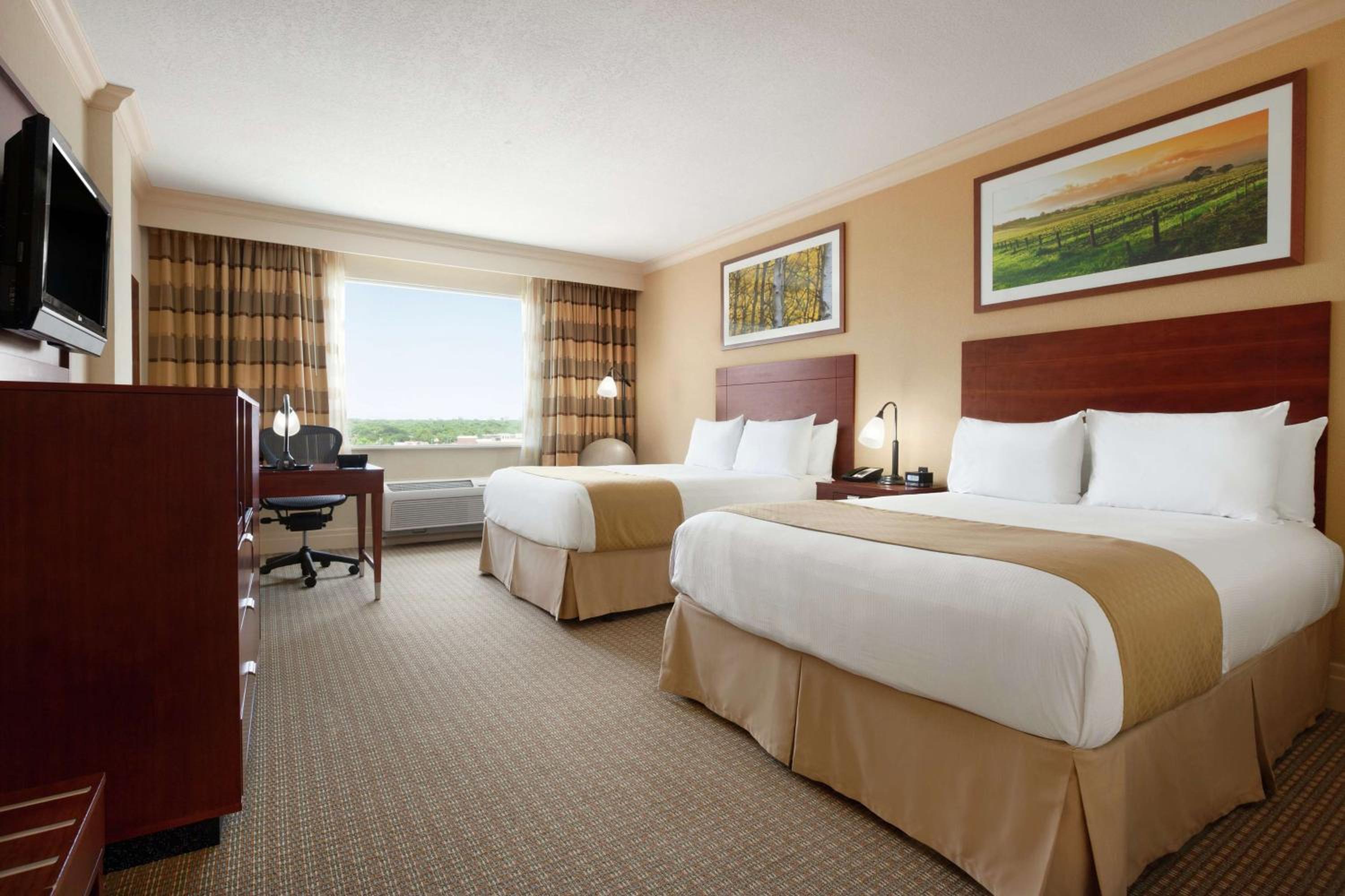 Queen Room with Two Queen Beds and Walk-In Shower - Photo 1